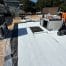 Flat roof under construction with white membrane