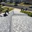 New gray shingle roof overlooking suburban street