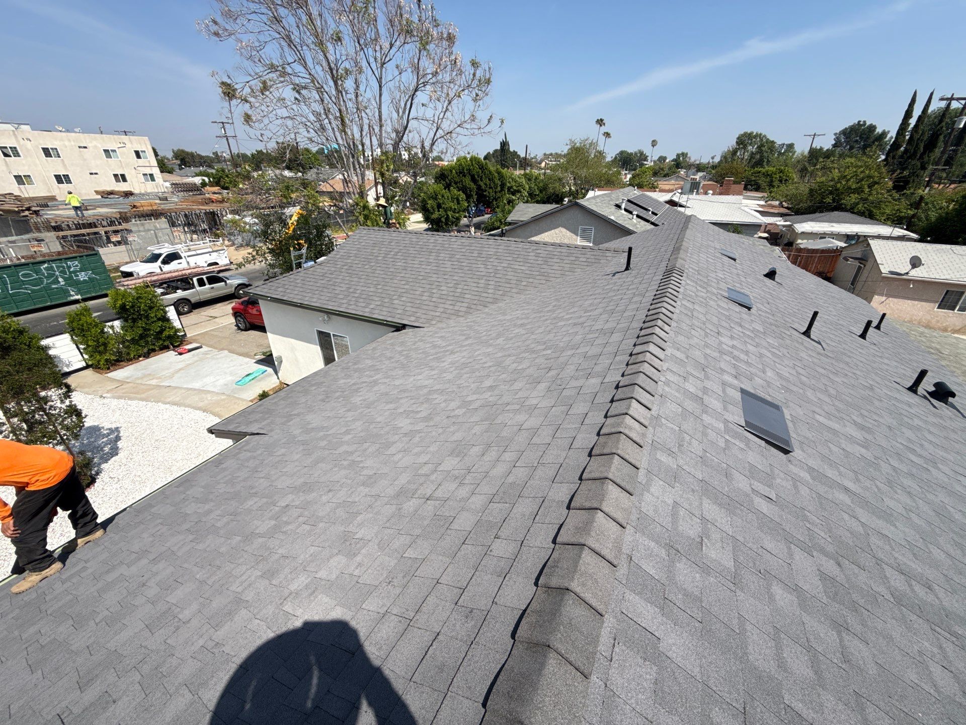 11-Mar 23 2026 01_53pm-fFti Gray shingle residential rooftop in suburban neighborhood