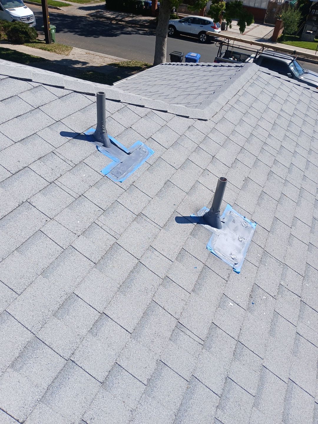 13-Mar 19 2026 10_59am-Ggt3 Gray shingle roof with two vent pipes