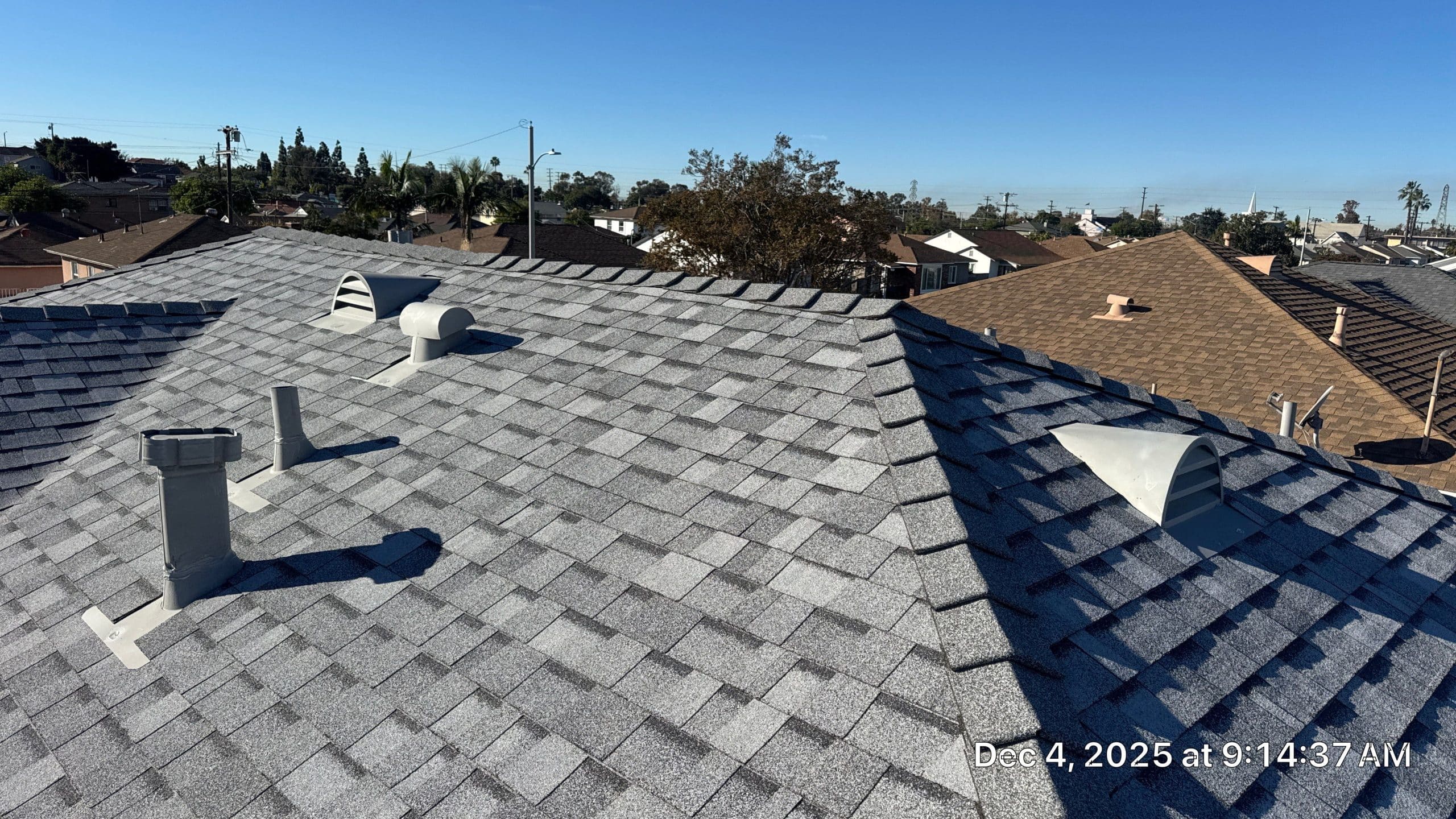 14-Dec 04 2025 09_14am-NpP7 Gray shingle residential rooftop with vents and ridge caps