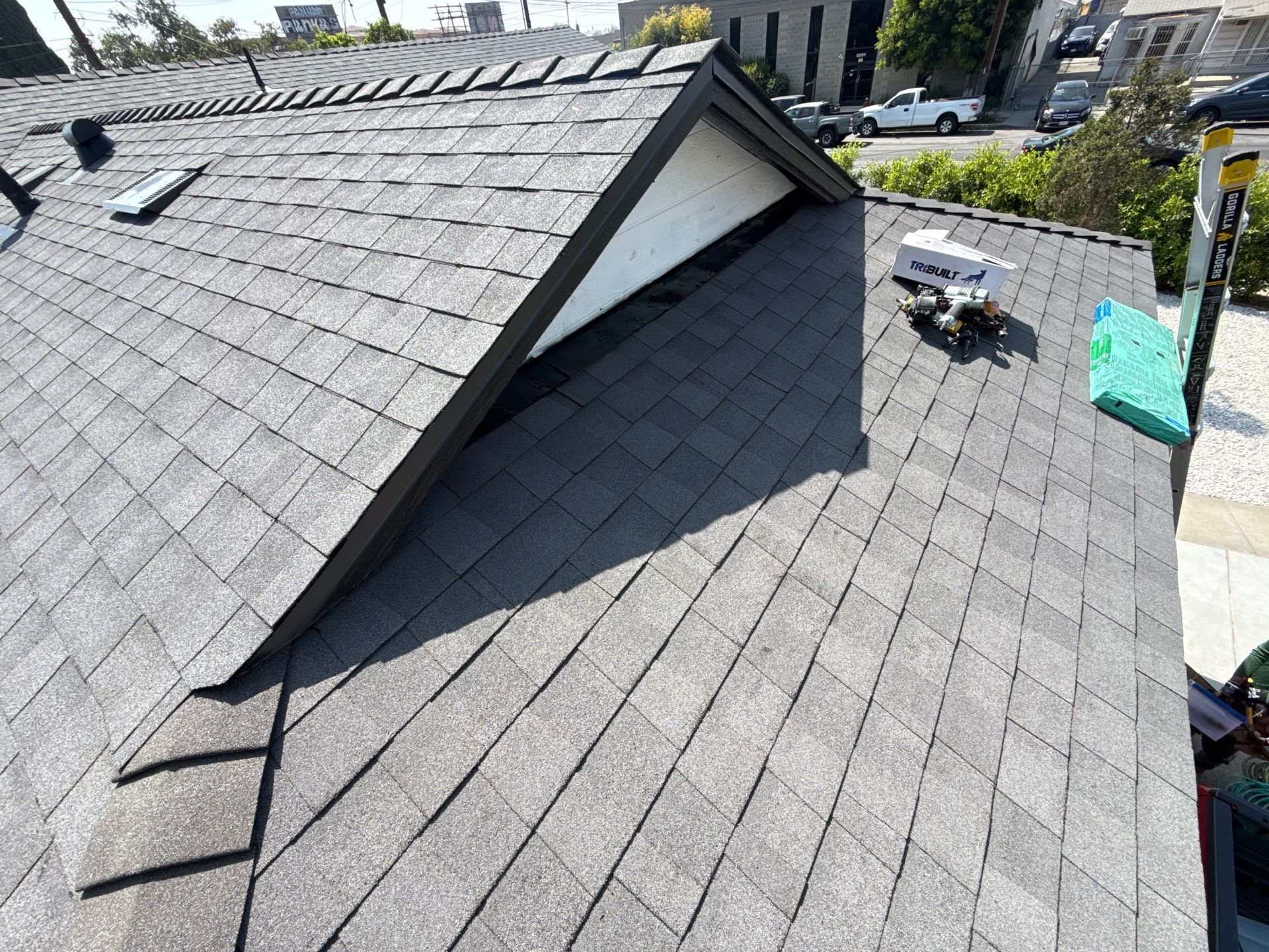 14-Mar 23 2026 01_54pm-oyEG Gray asphalt shingle roof with dormer and tools