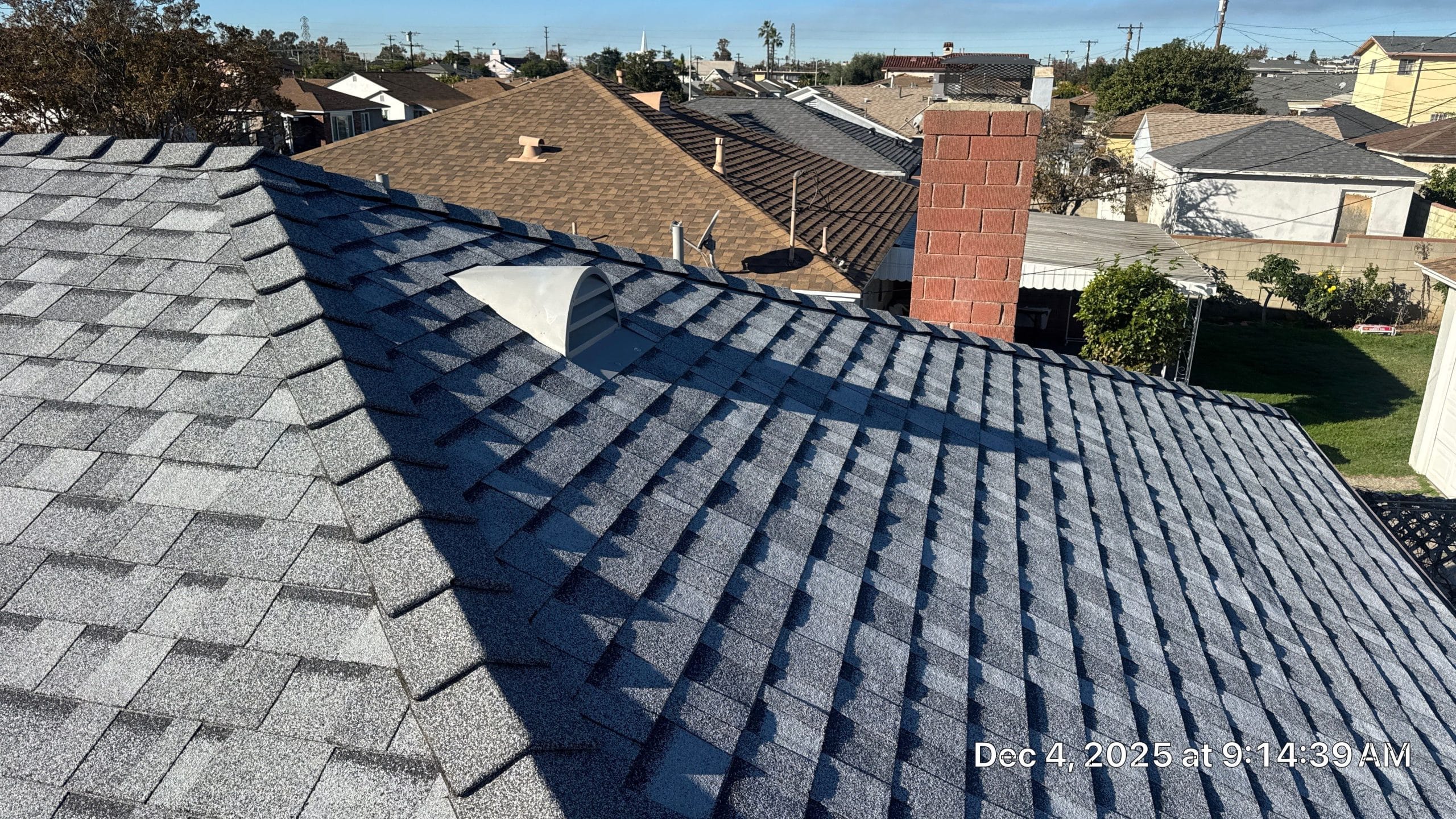 15-Dec 04 2025 09_14am-3AC7 Gray asphalt shingle roof with ridge vent and chimney