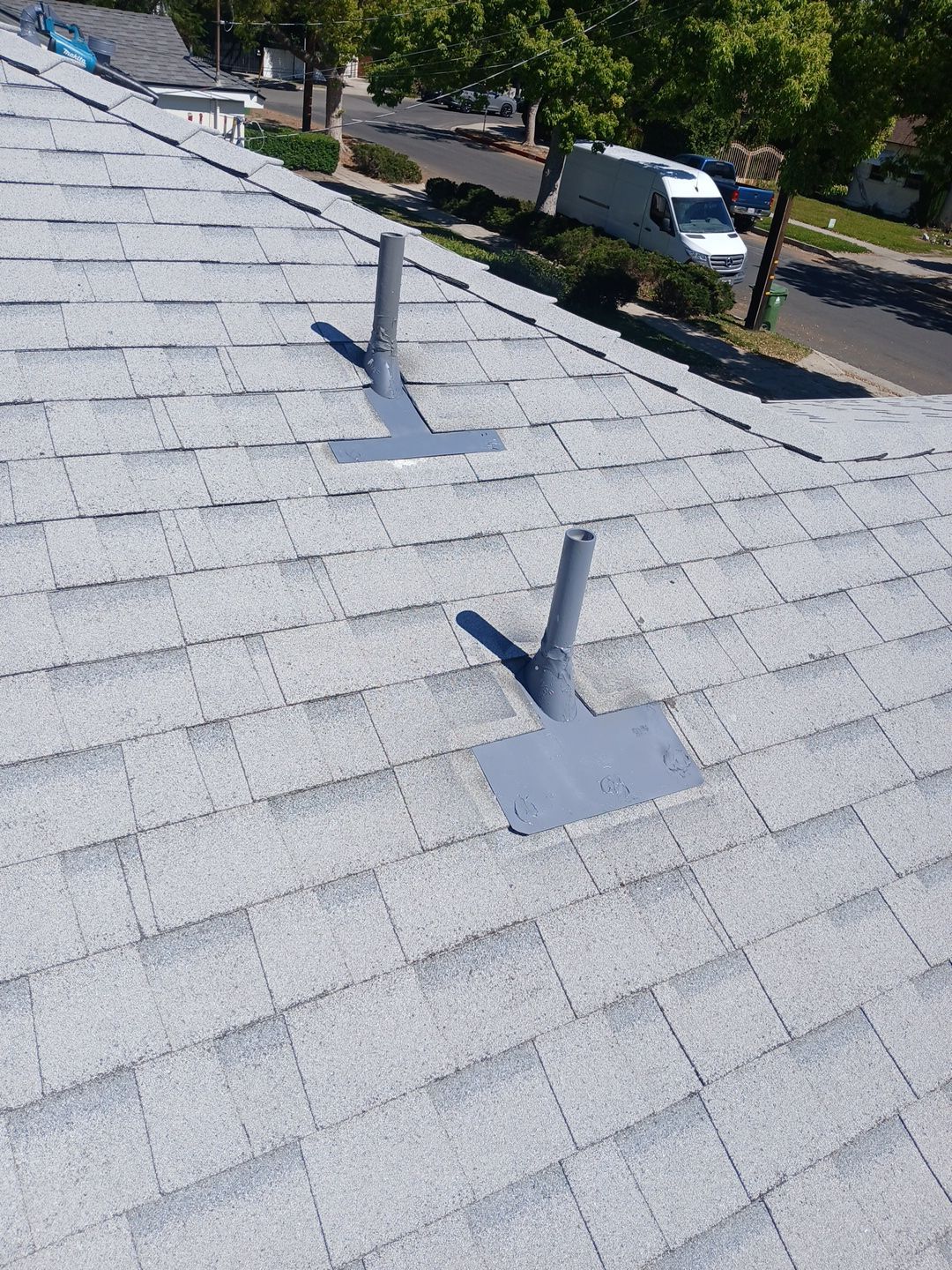 16-Mar 19 2026 11_56am-rPPy Residential roof with vent pipes and flashing