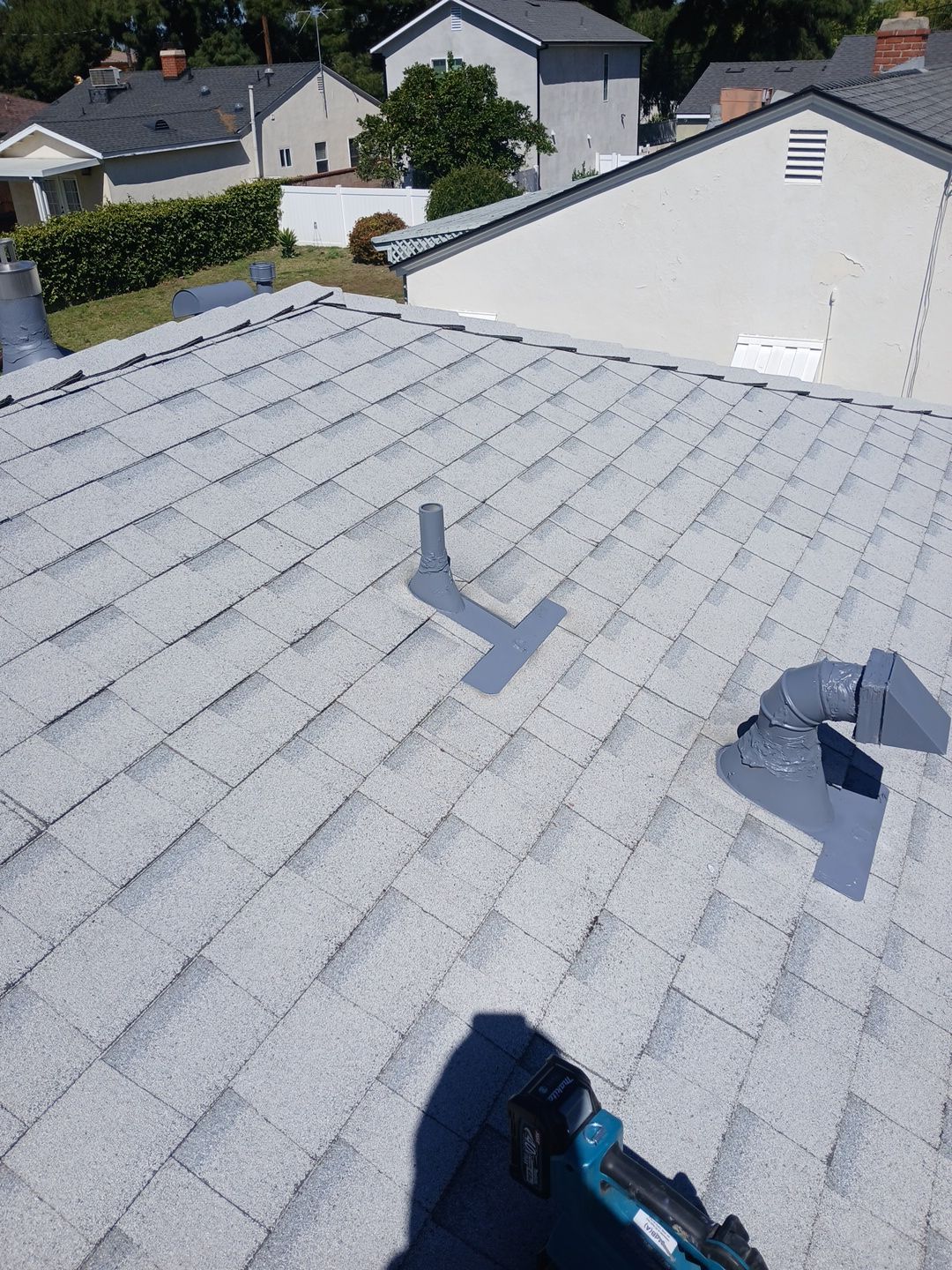 20-Mar 19 2026 11_56am-MFcH Residential shingle roof with vents and neighboring houses