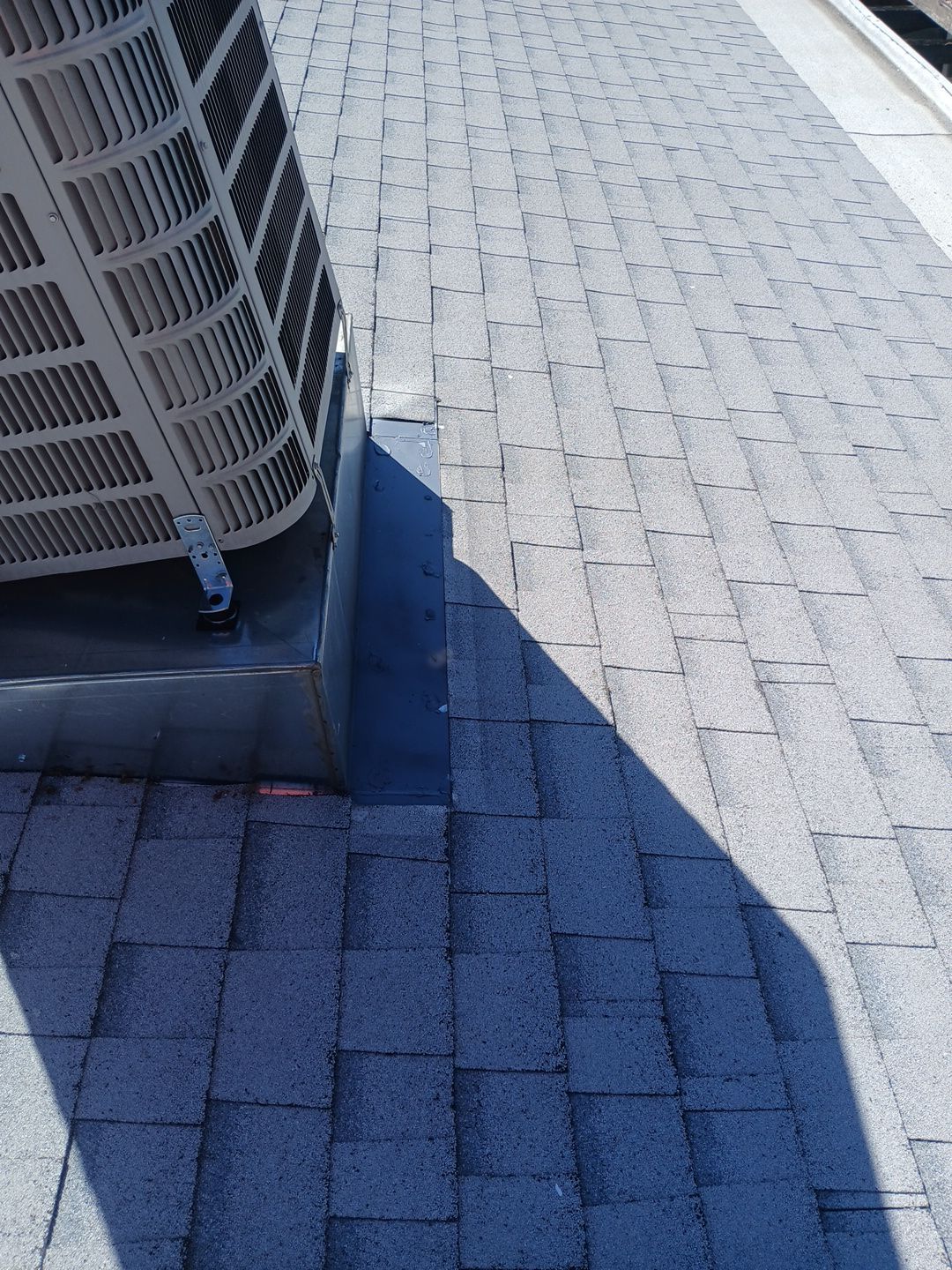23-Mar 19 2026 11_56am-f2iH Rooftop HVAC unit on asphalt shingle roof