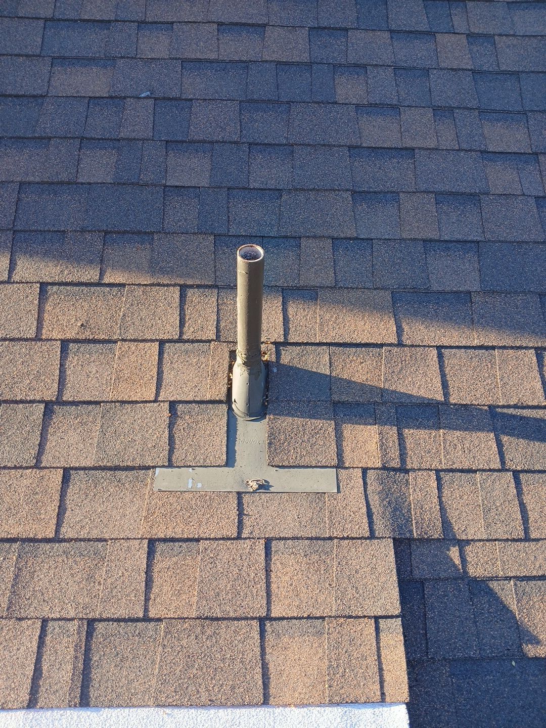24-Mar 17 2026 08_01am-CpPk Roof vent pipe on asphalt shingle roof