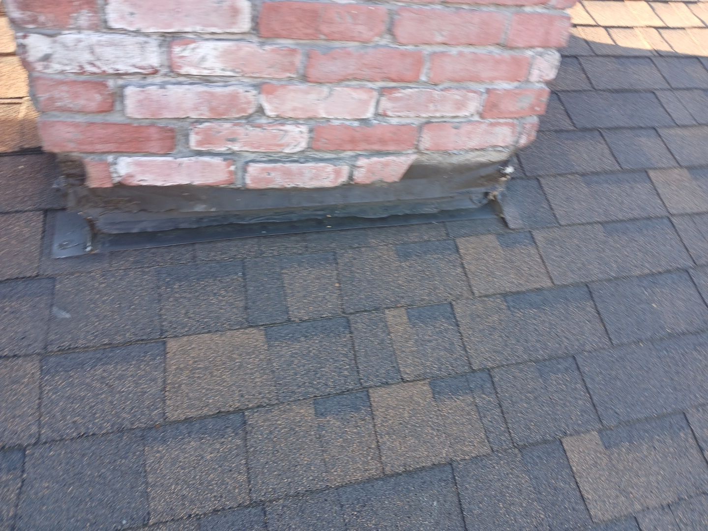 3-Mar 17 2026 07_59am-j6NU Brick column base with roof shingles and flashing