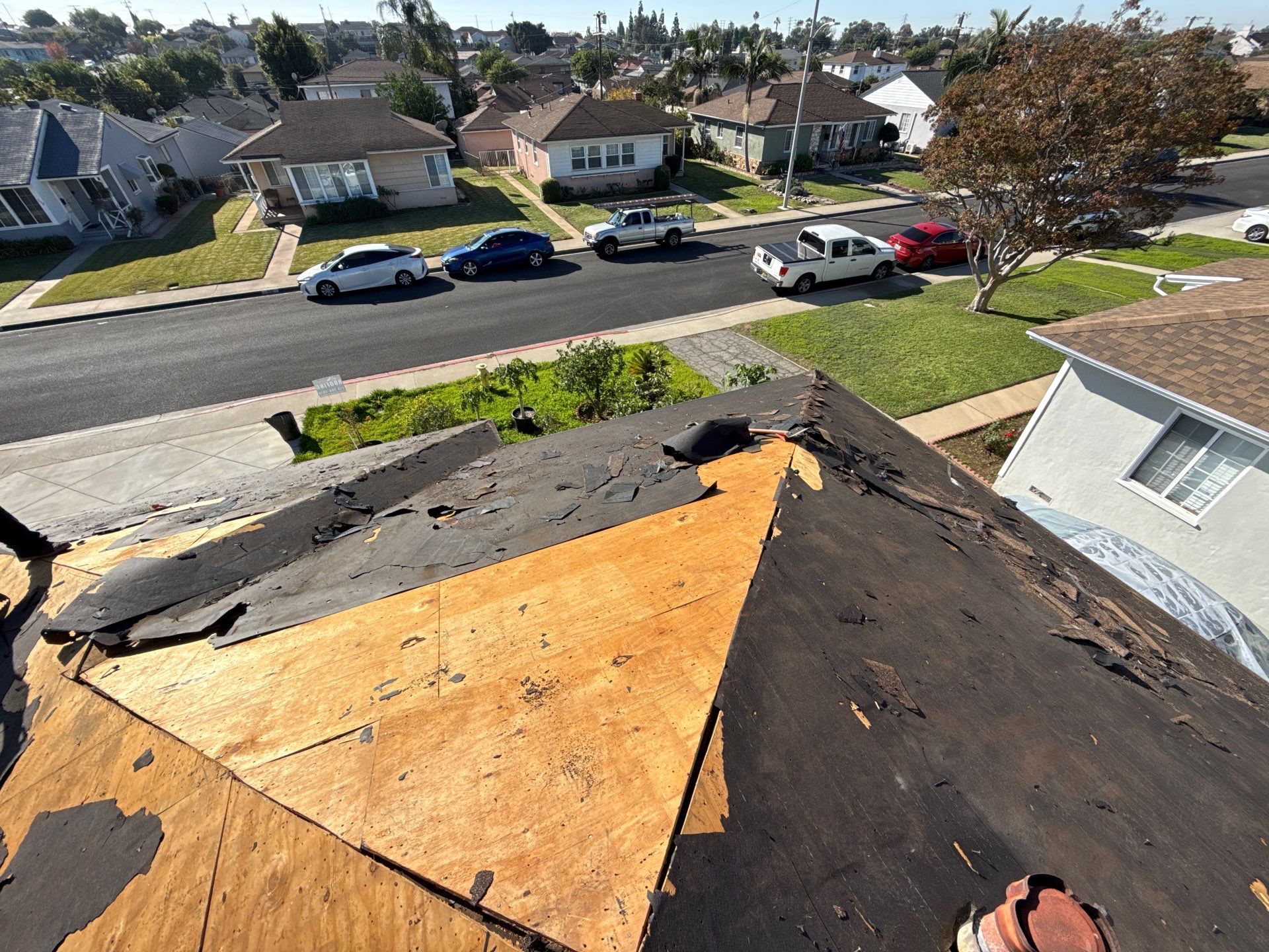 3-Nov 28 2025 09_55am-jwLV Residential roof with shingles removed in suburban neighborhood