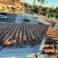Clay tile rooftop overlooking busy city intersection
