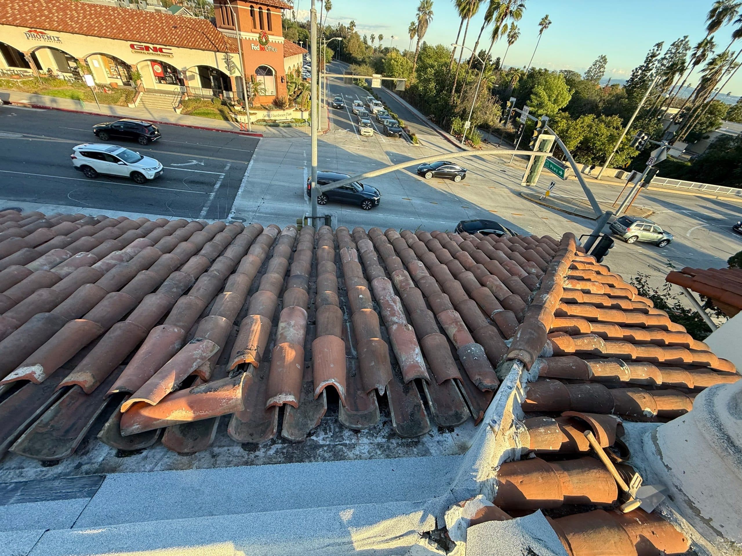 Clay tile rooftop overlooking busy city intersection
