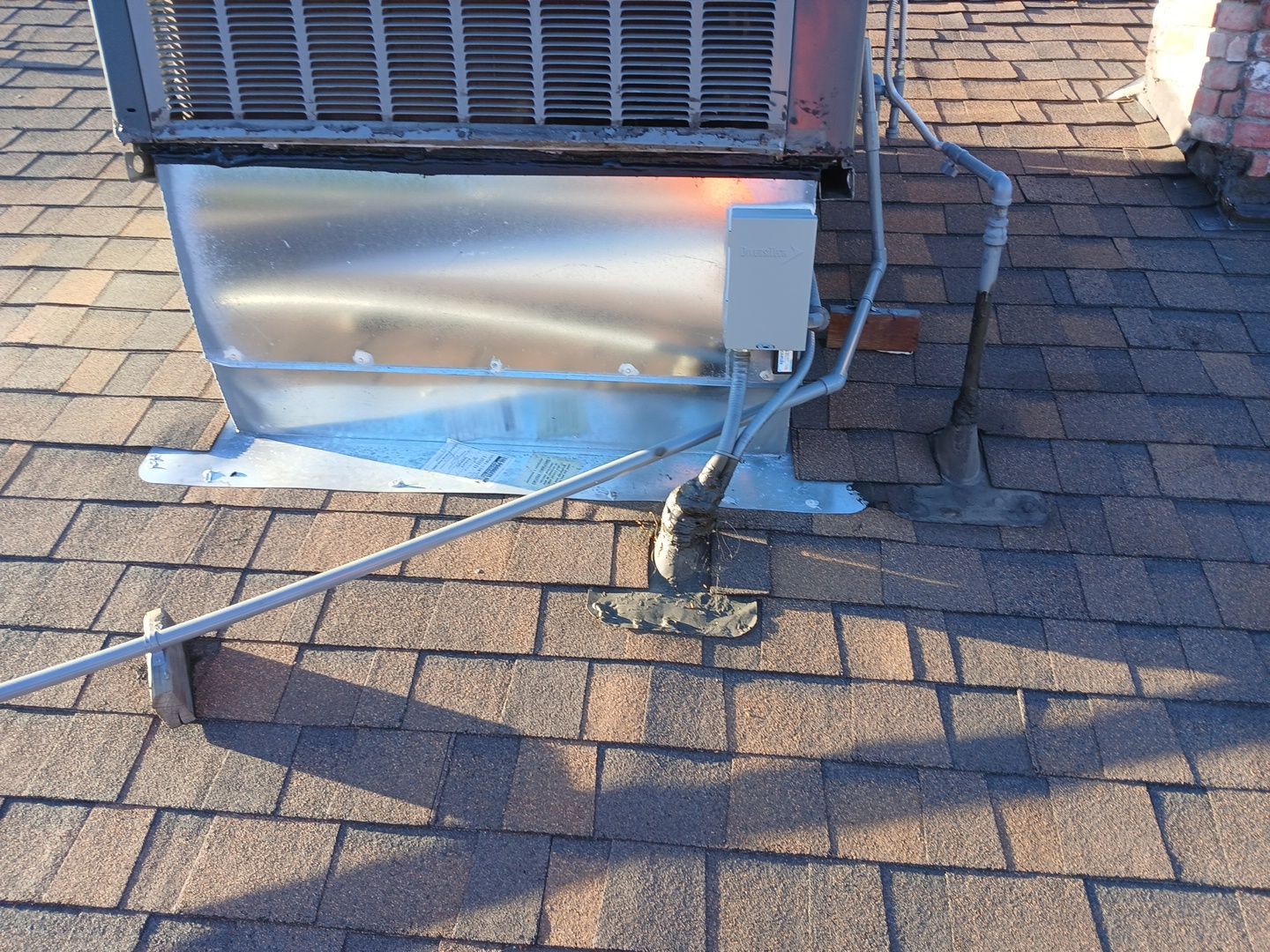 5-Mar 17 2026 08_00am-Az9F Rooftop HVAC unit with conduit and flashing
