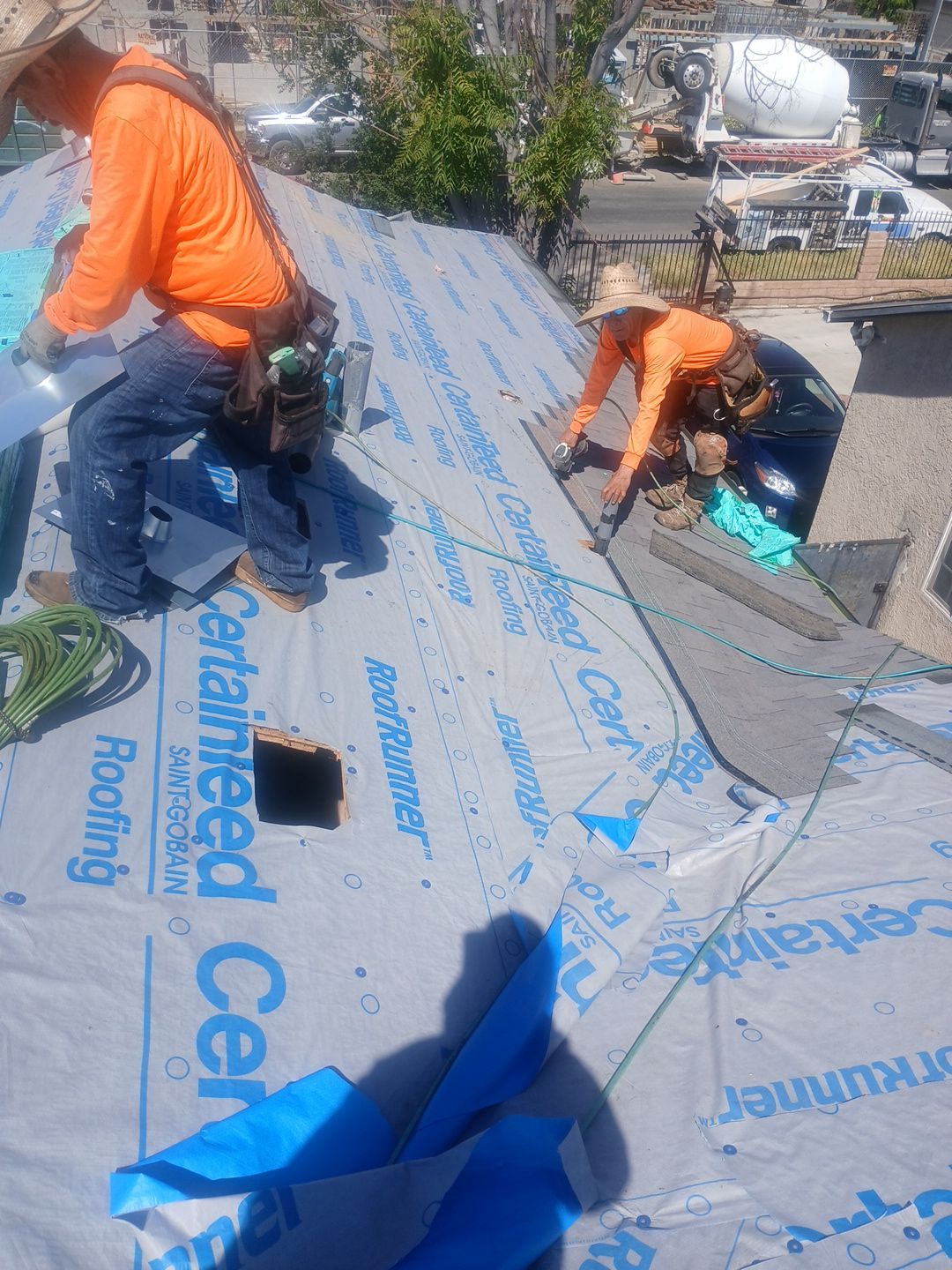 6-Mar 20 2026 01_50pm-VG9t Roofers installing underlayment on residential sloped roof