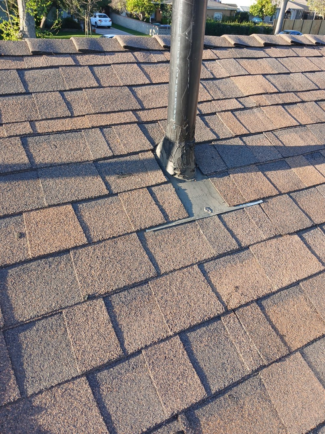 8-Mar 17 2026 08_00am-EjKx Roof vent pipe with metal flashing on shingles