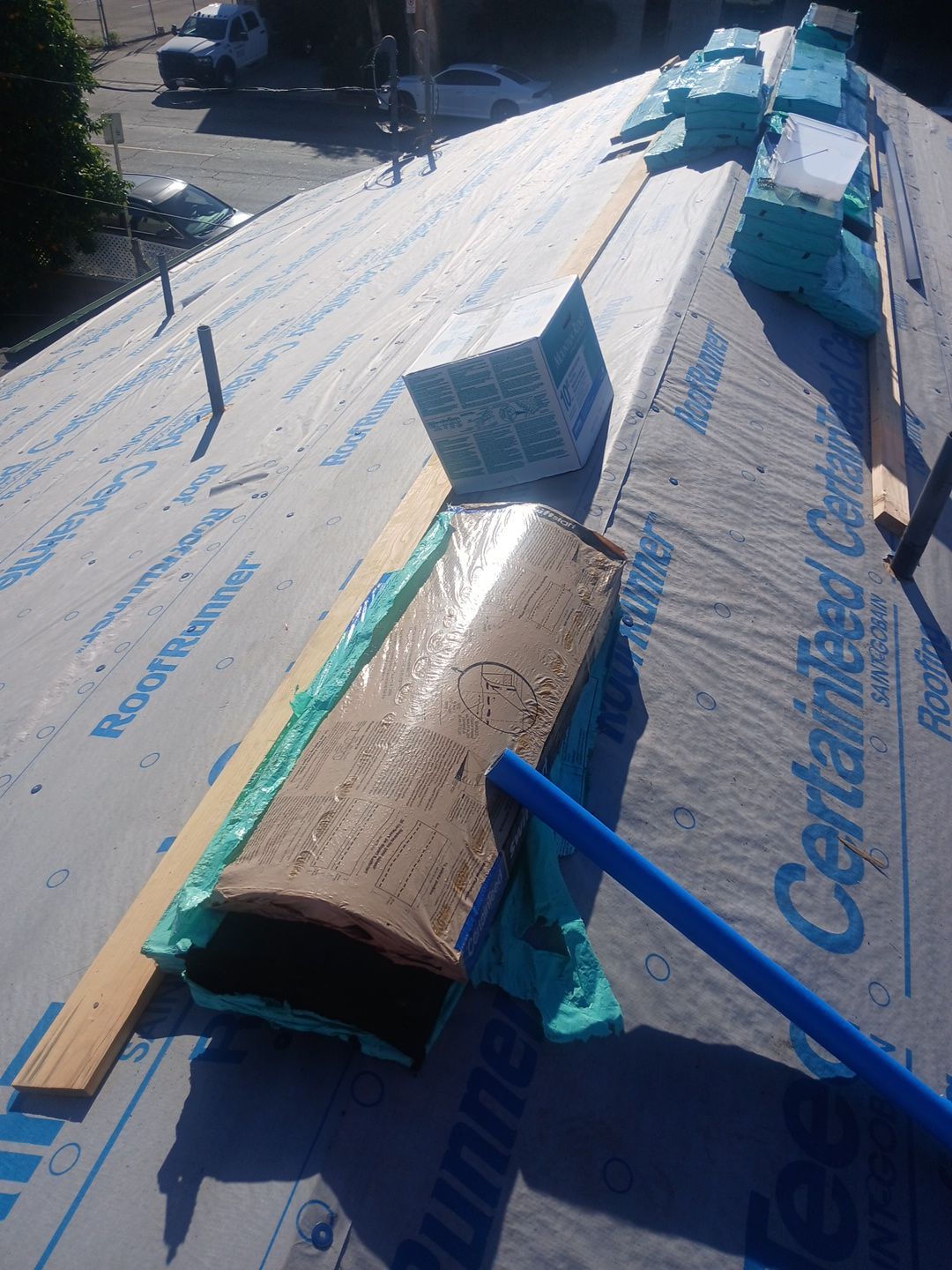 8-Mar 20 2026 04_39pm-xCej Roof under construction with insulation and underlayment