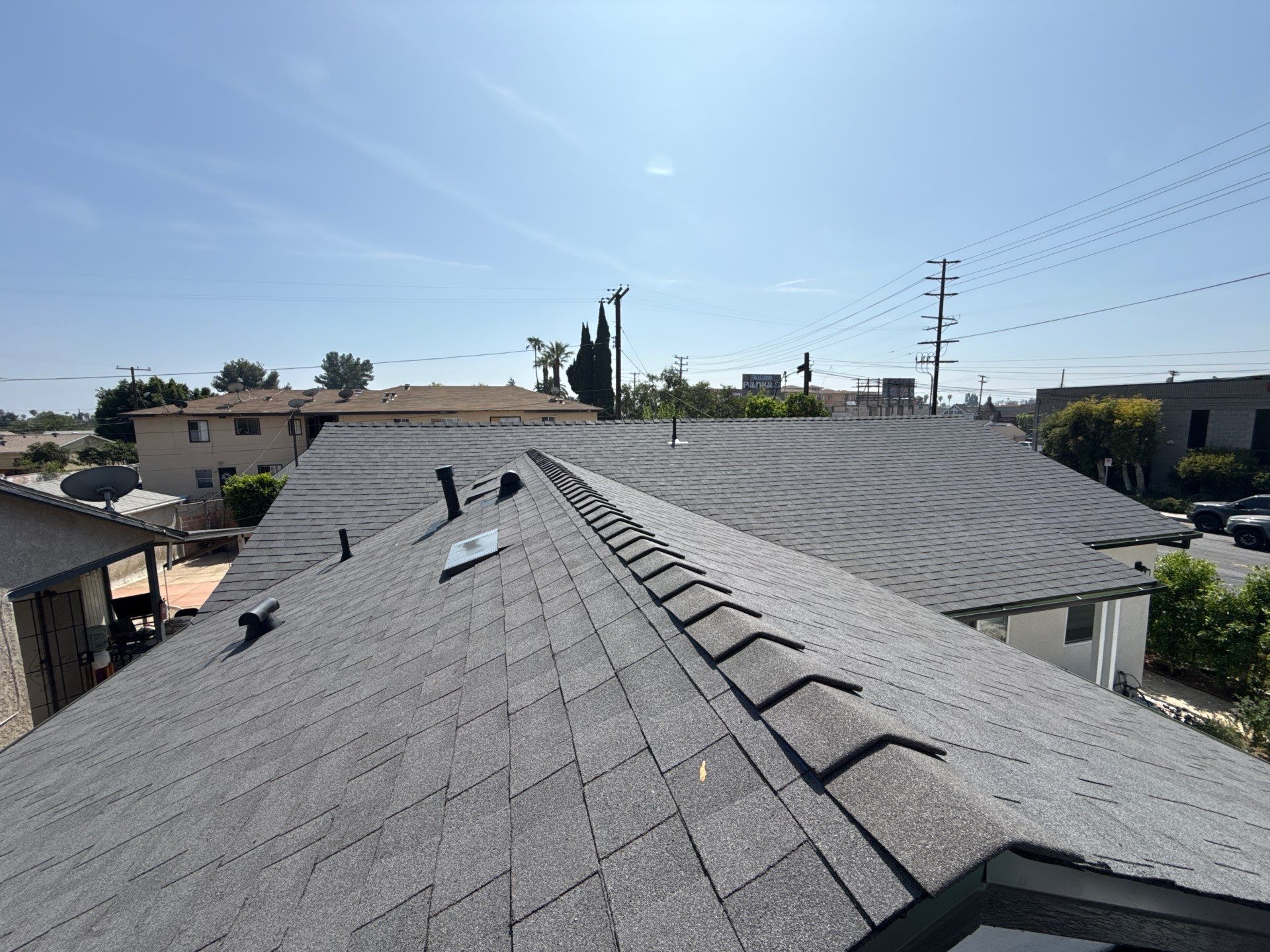 Before and After-15-Mar 23 2026 01_54pm-ZcLi Gray shingle rooftop under clear blue sky