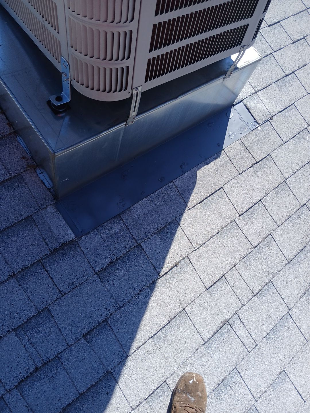 Before and After-25-Mar 19 2026 11_56am-dM3z Rooftop HVAC unit on shingle roof