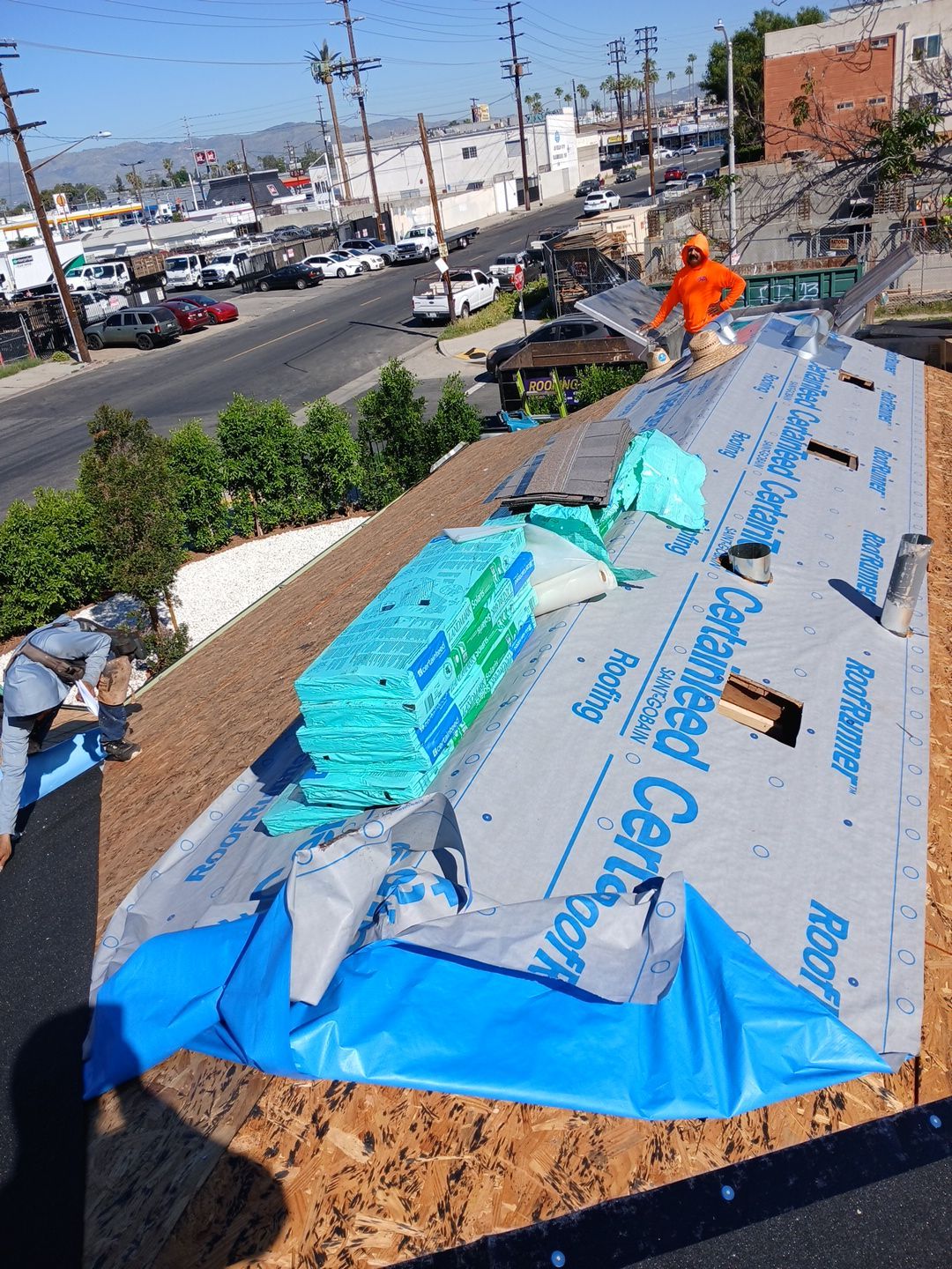 Before and After-3-Mar 20 2026 10_27am-446q Roofers installing underlayment on residential rooftop