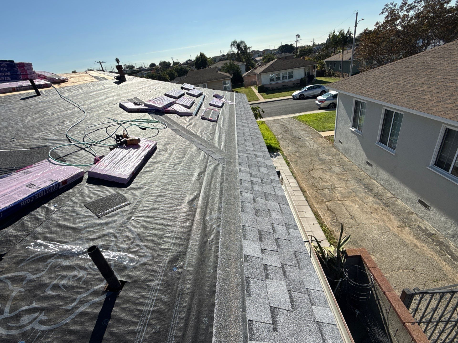 Before and After-8-Dec 02 2025 11_11am-RM5f Residential roof under renovation with shingles and tools