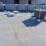 Flat commercial rooftop with HVAC unit and vents