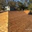 Roof under renovation with exposed plywood sheathing