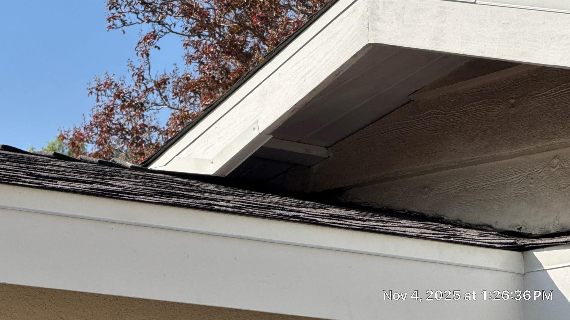 Weathered asphalt shingles at eave, fascia board, and soffit corner | Roof Replacement Inc Weathered asphalt shingles at eave, fascia board, and soffit corner — Roof Replacement Inc