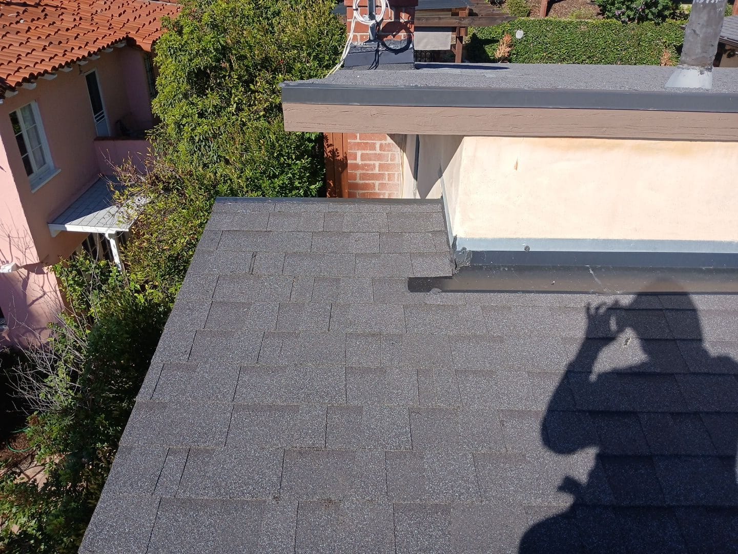 gray asphalt shingle roof slope with flat roof section adjacent — Glendale — Roof Replacement Inc