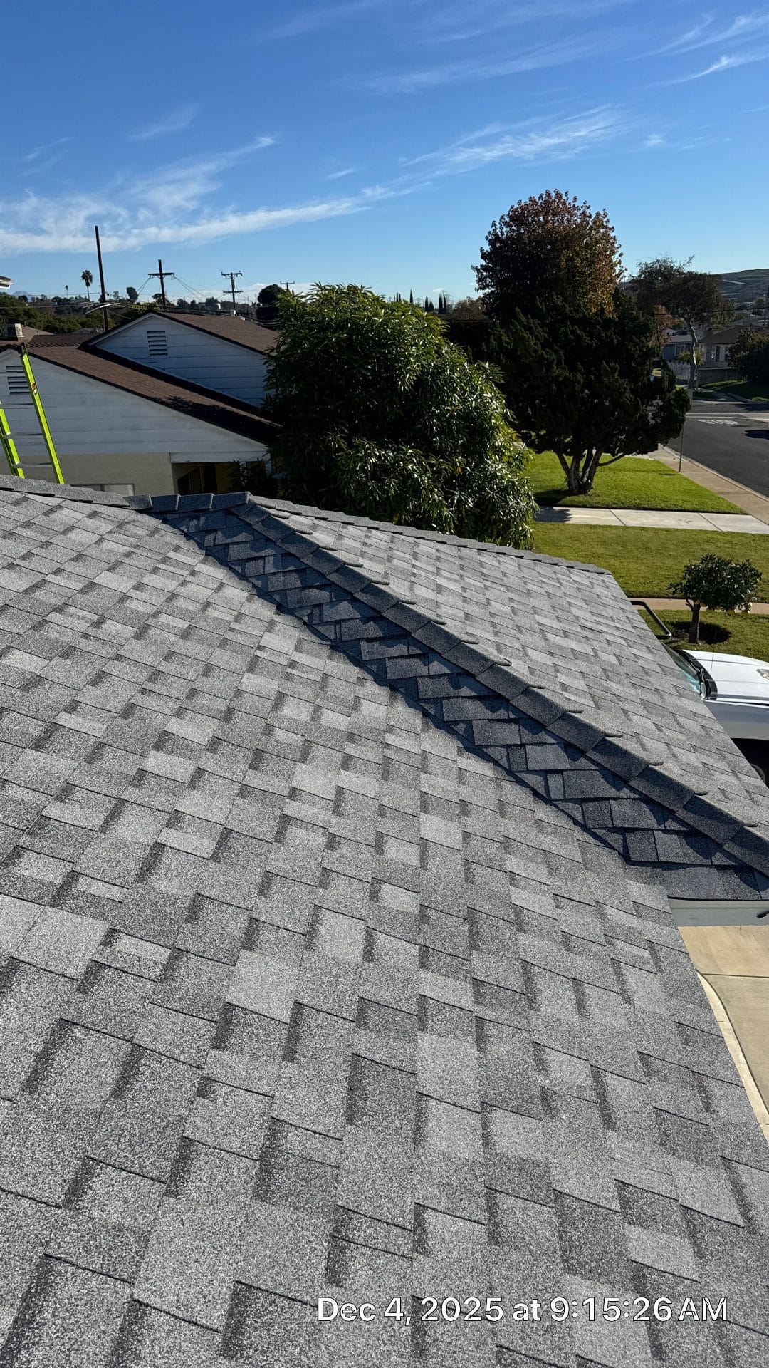 Gray asphalt shingle roof with hip ridge cap installation | Roof Replacement Inc Gray asphalt shingle roof with hip ridge cap installation — Roof Replacement Inc