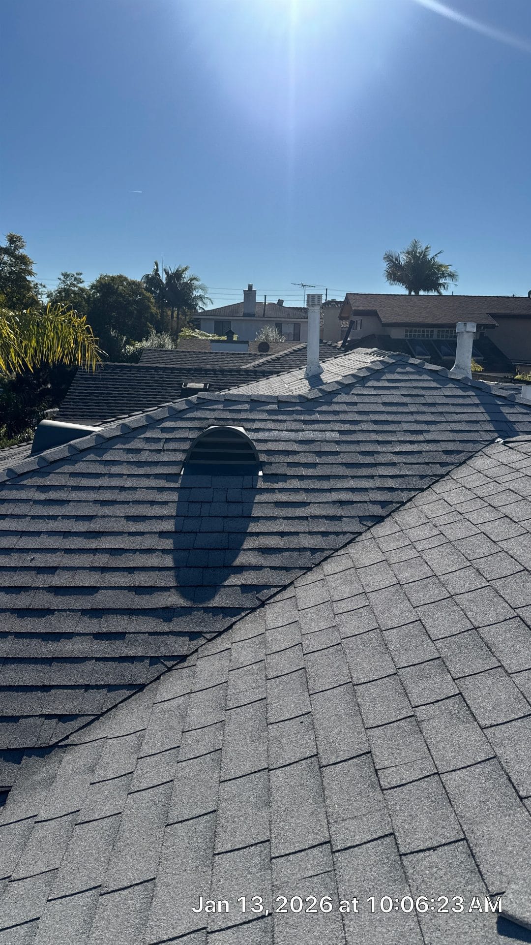 Gray asphalt shingle roof with oval dormer, pipe vents, hip ridges | Roof Replacement Inc Gray asphalt shingle roof with oval dormer, pipe vents, hip ridges — Roof Replacement Inc