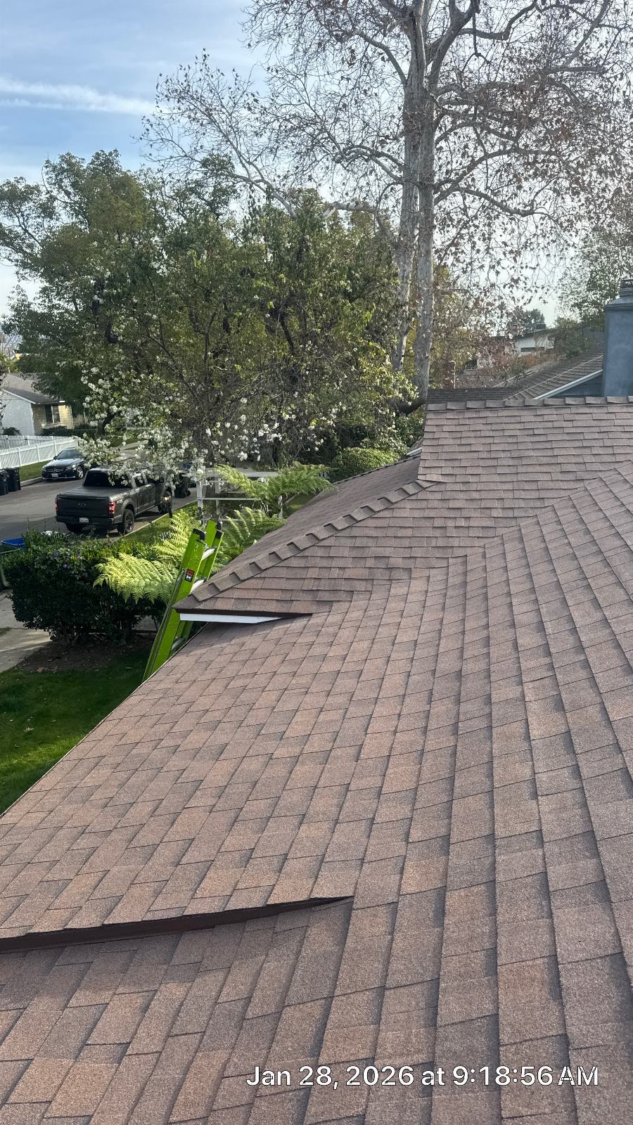 New brown asphalt shingle roof with hip and valley sections | Roof Replacement Inc New brown asphalt shingle roof with hip and valley sections — Roof Replacement Inc