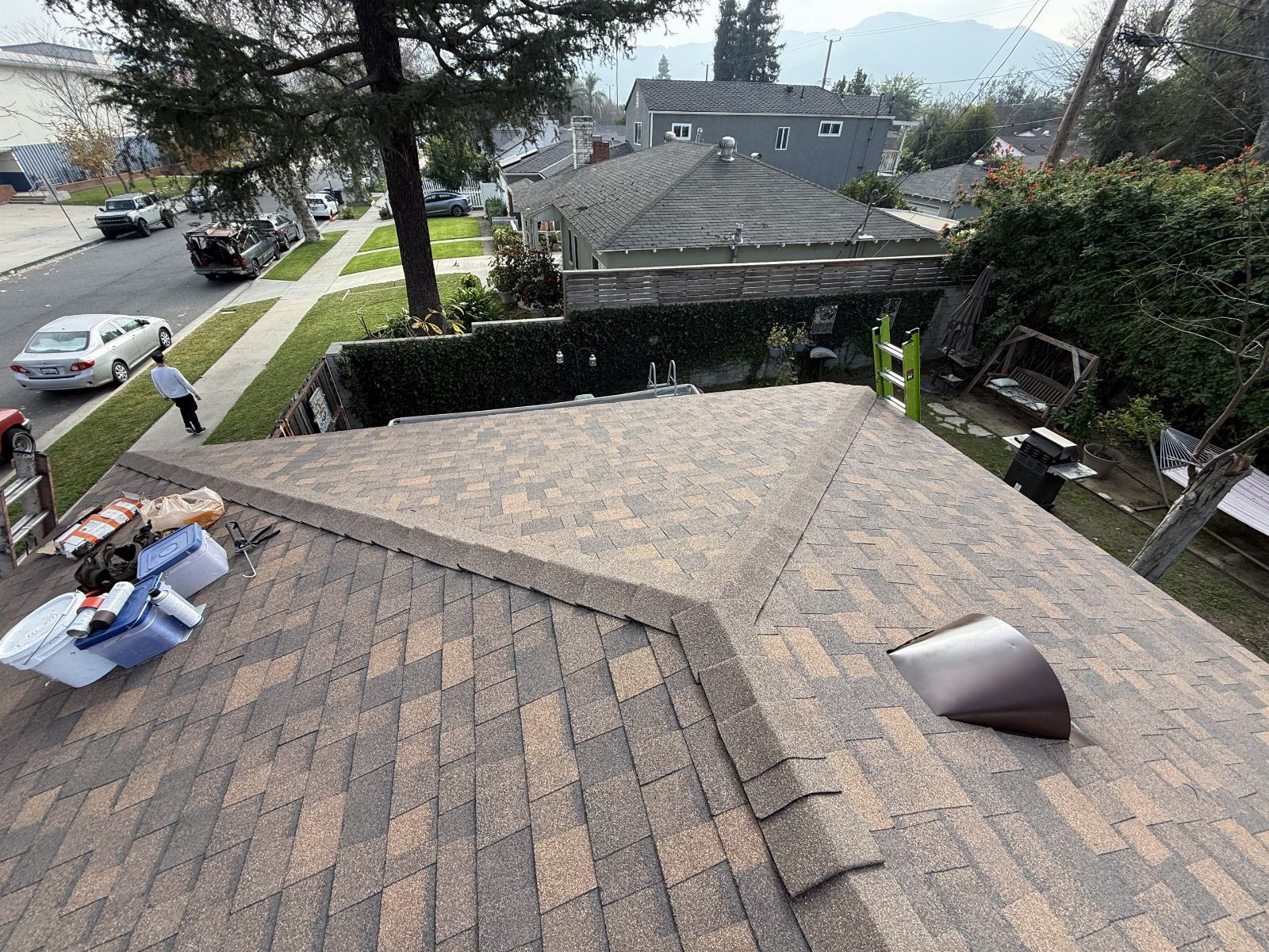 new asphalt shingle roof with hip ridge and roof vent installed — Burbank — Roof Replacement Inc