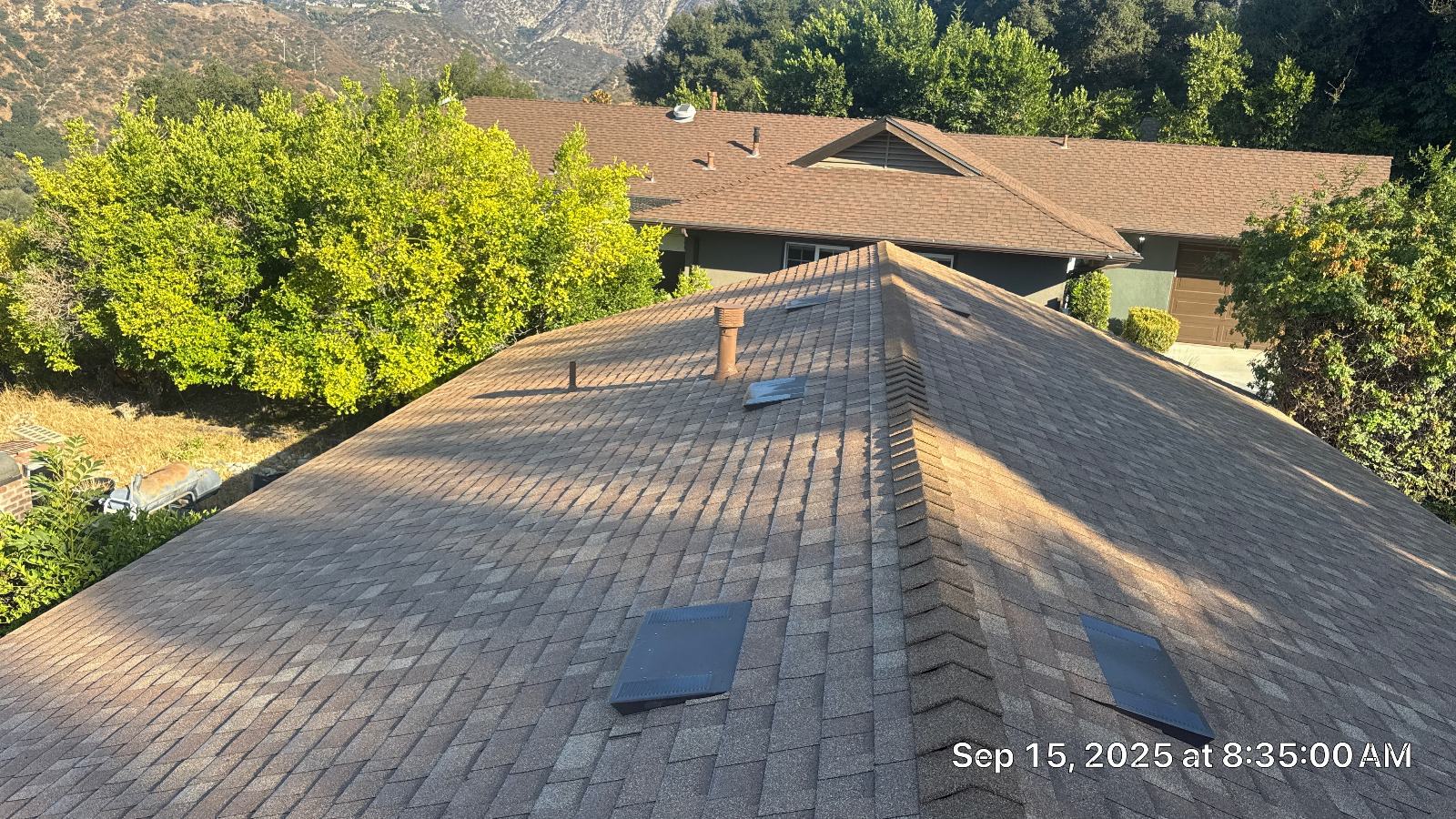 Asphalt shingle hip roof with pipe boot and four roof vents in Altadena | Roof Replacement Inc asphalt shingle hip roof with pipe boot and four roof vents — Altadena — Roof Replacement Inc