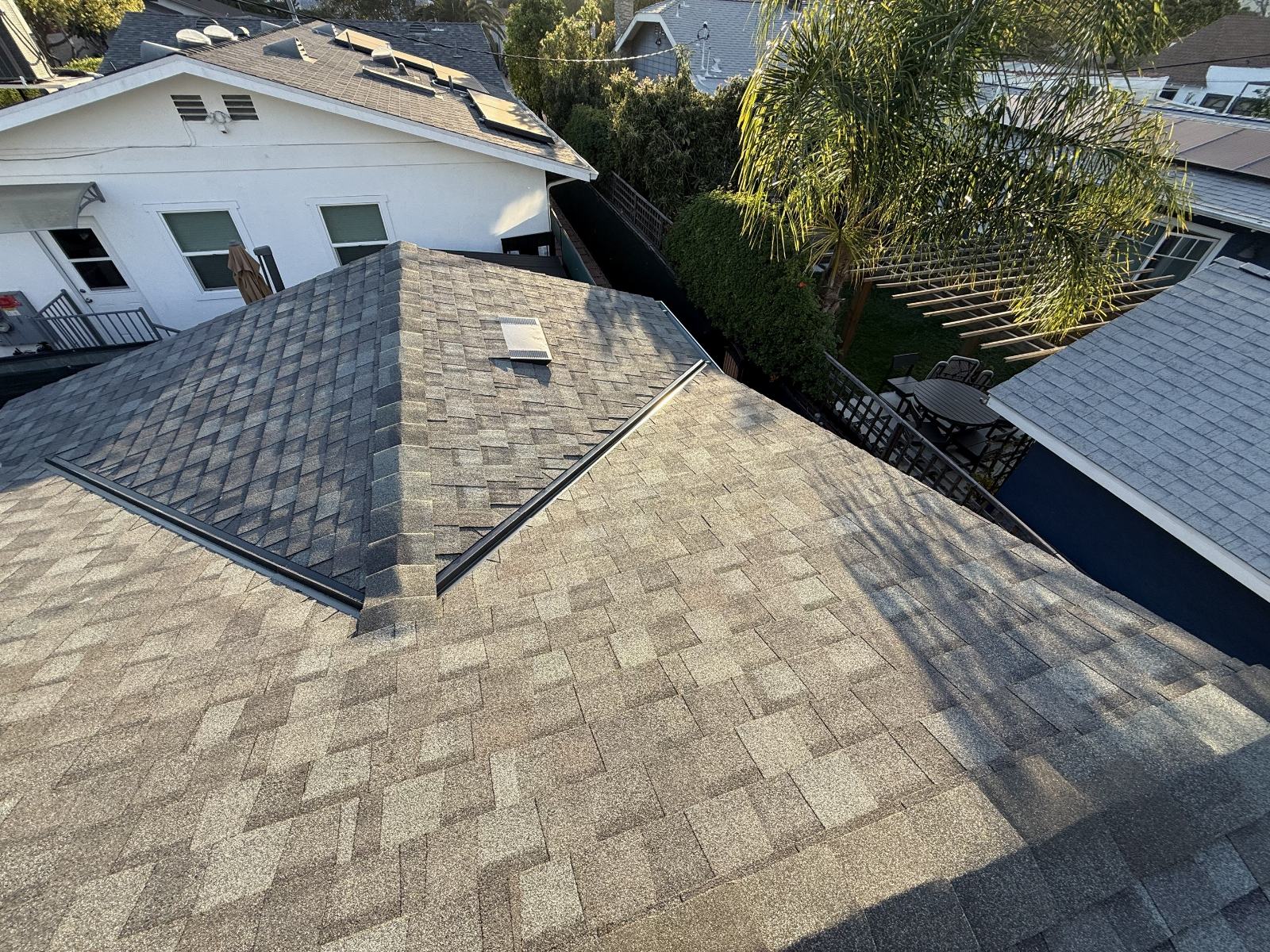 Asphalt shingle roof with hip valleys and rooftop vent | Roof Replacement Inc Asphalt shingle roof with hip valleys and rooftop vent — Roof Replacement Inc