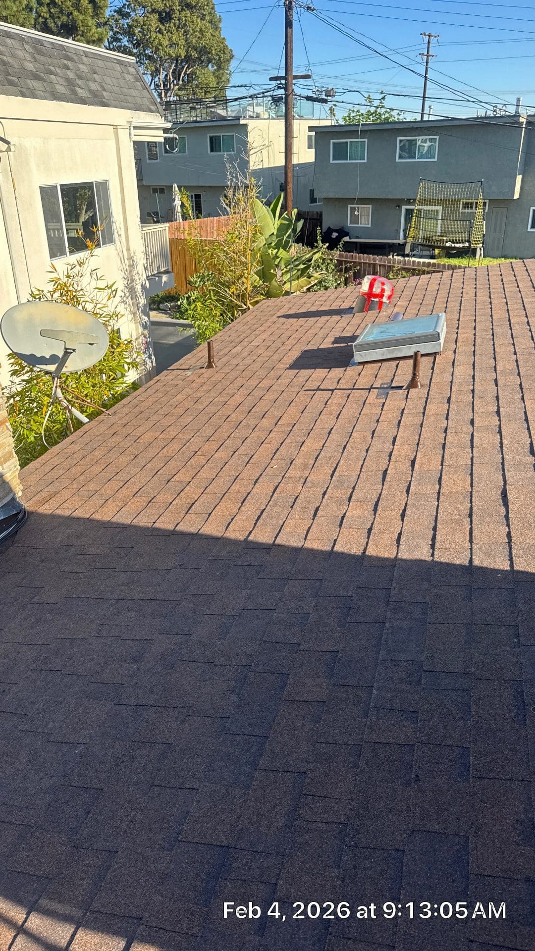 Completed asphalt shingle re-roof, low-slope section, skylight, satellite dish | Roof Replacement Inc Completed asphalt shingle re-roof, low-slope section, skylight, satellite dish — Roof Replacement Inc