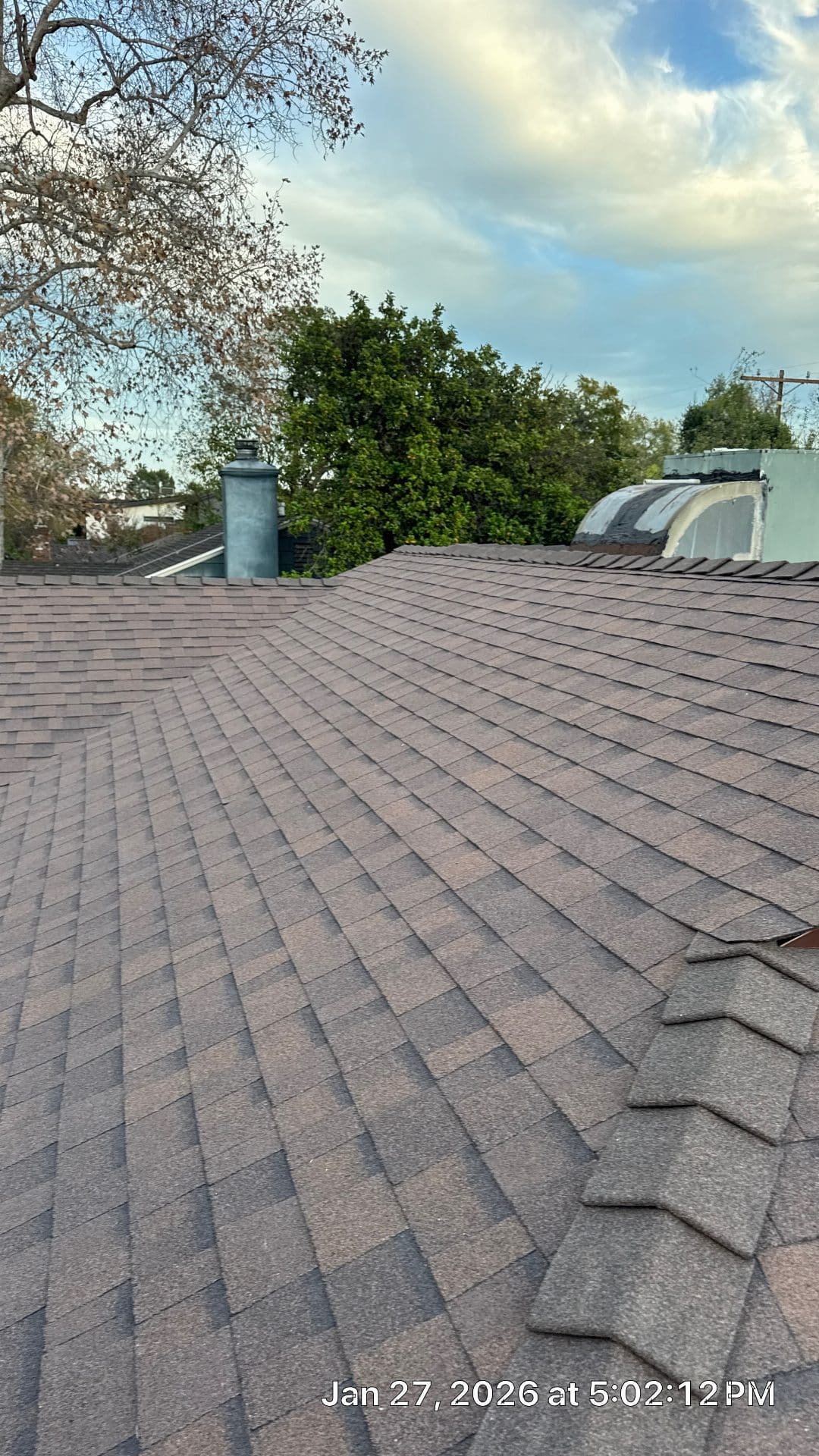 Completed asphalt shingle roof with chimney and HVAC unit | Roof Replacement Inc Completed asphalt shingle roof with chimney and HVAC unit — Roof Replacement Inc