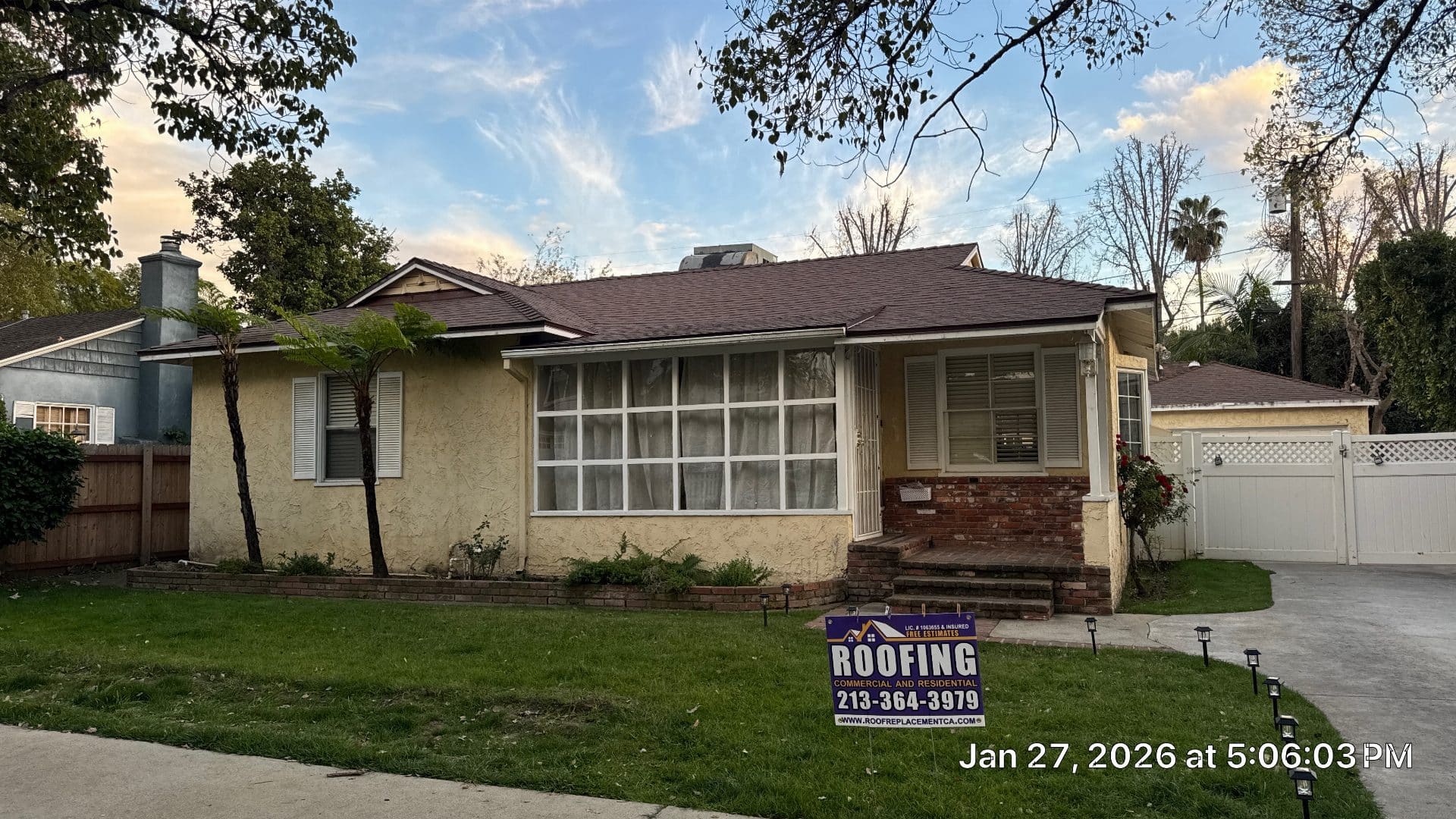 Single-story home with new dark brown asphalt shingle roof installed | Roof Replacement Inc Single-story home with new dark brown asphalt shingle roof installed — Roof Replacement Inc