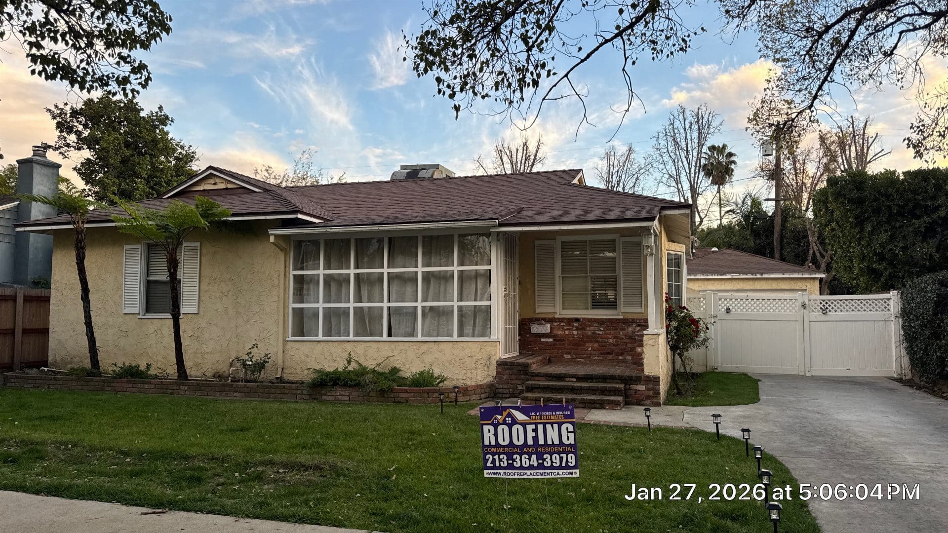 Single-story home with new dark brown asphalt shingle roof installed — Roof Replacement Inc