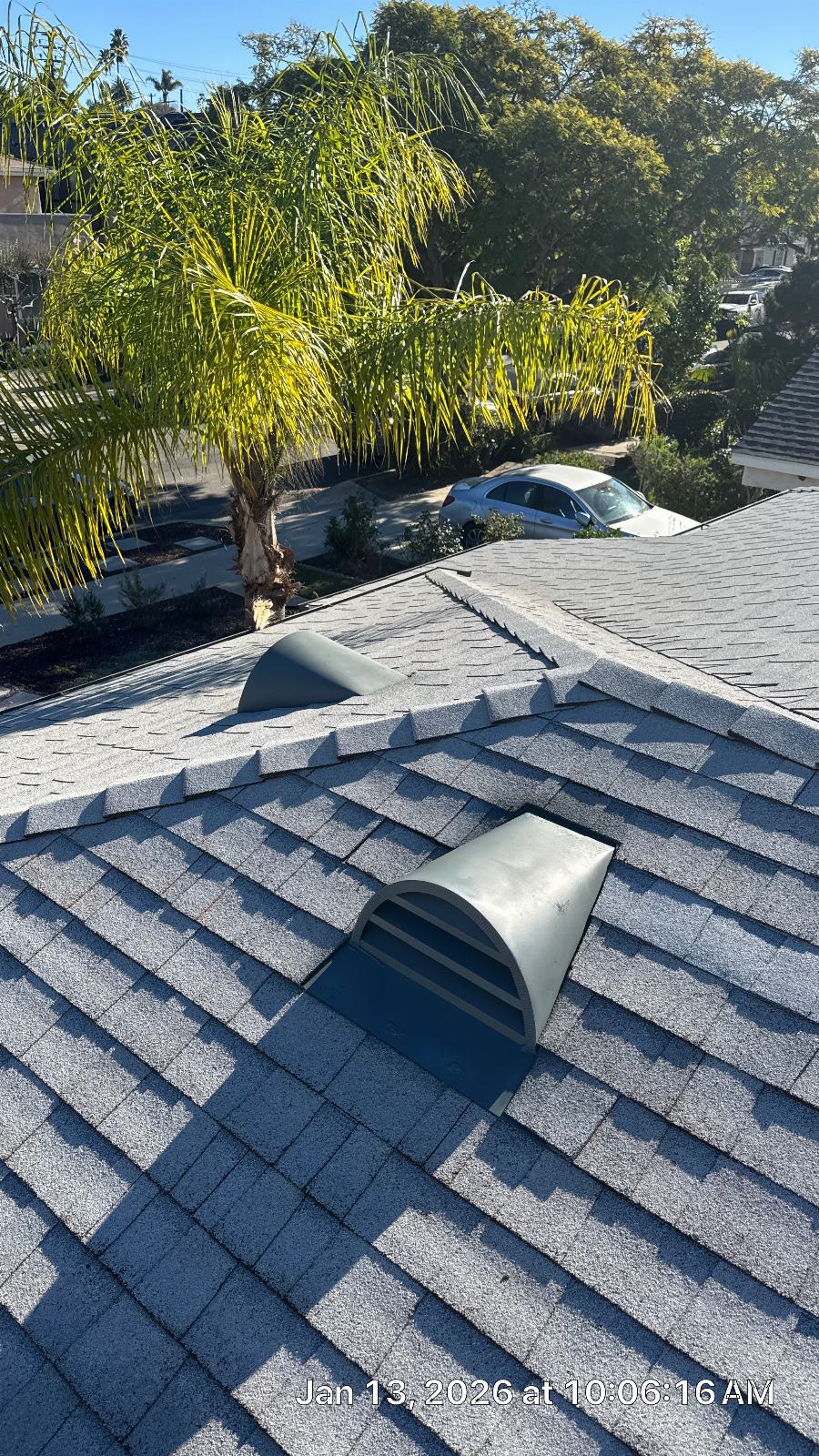 Gray asphalt shingle roof with two metal dome vents installed | Roof Replacement Inc Gray asphalt shingle roof with two metal dome vents installed — Roof Replacement Inc