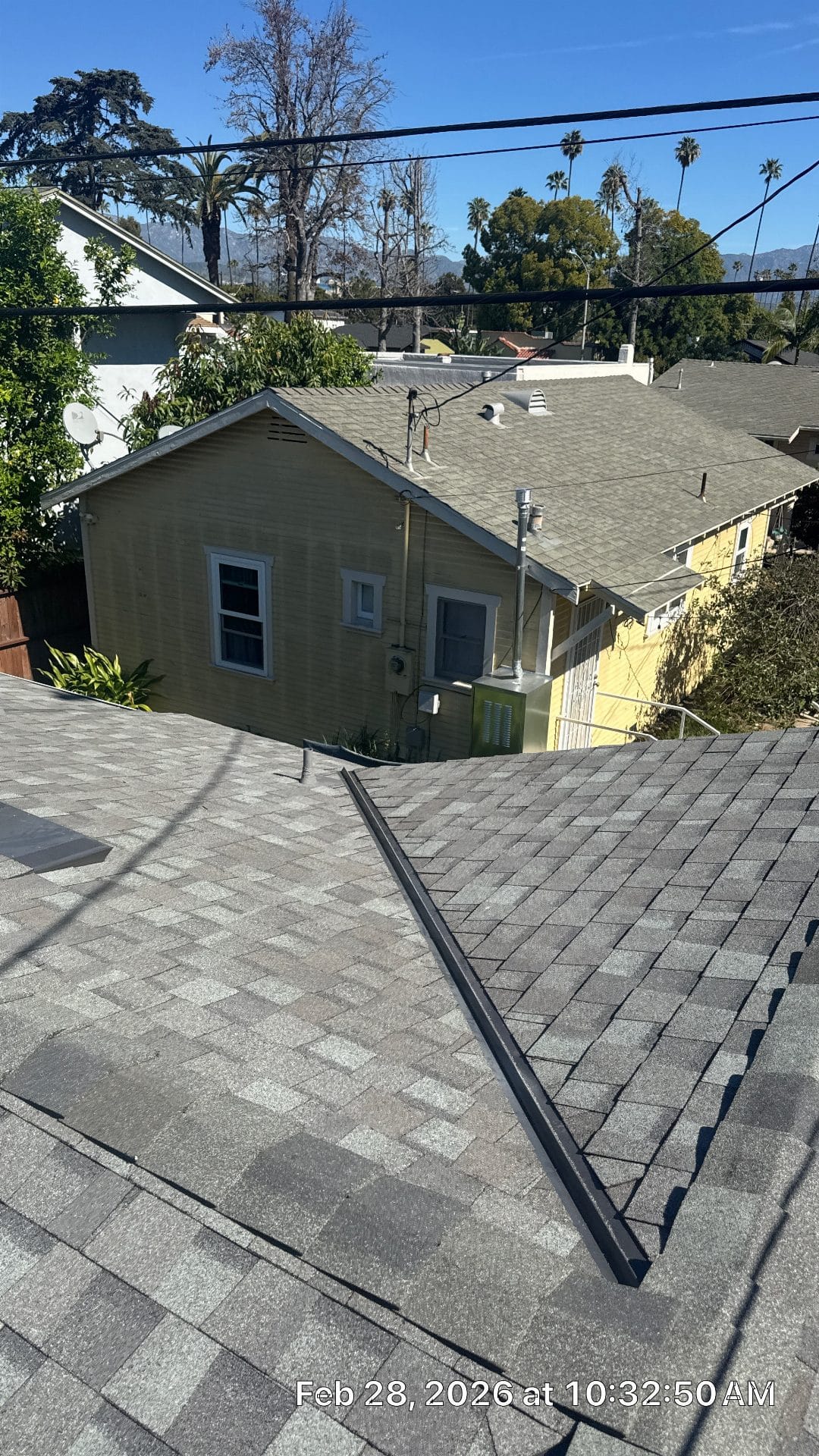 Gray asphalt shingle roof with metal drip edge strip installed | Roof Replacement Inc gray asphalt shingle roof with metal drip edge strip installed — Roof Replacement Inc