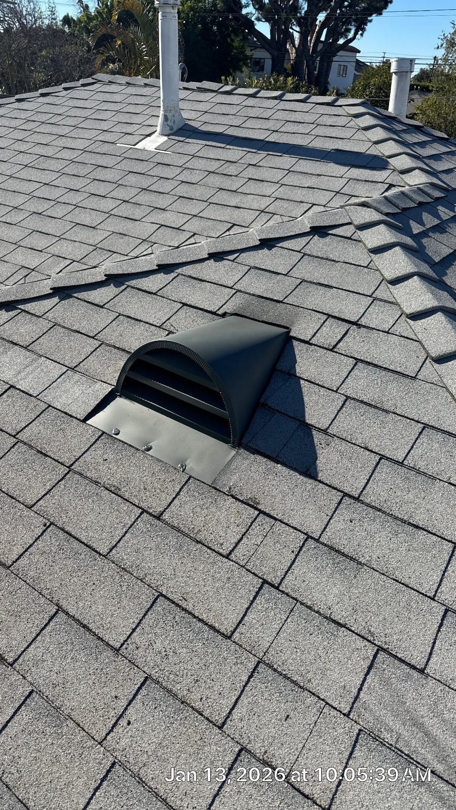 Gray asphalt shingle roof with black exhaust vent installed | Roof Replacement Inc Gray asphalt shingle roof with black exhaust vent installed — Roof Replacement Inc