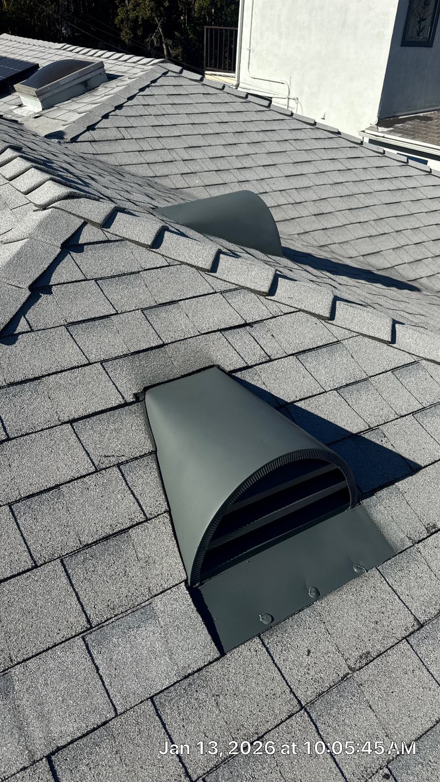 Gray asphalt shingle roof with two exhaust vent caps installed | Roof Replacement Inc Gray asphalt shingle roof with two exhaust vent caps installed — Roof Replacement Inc