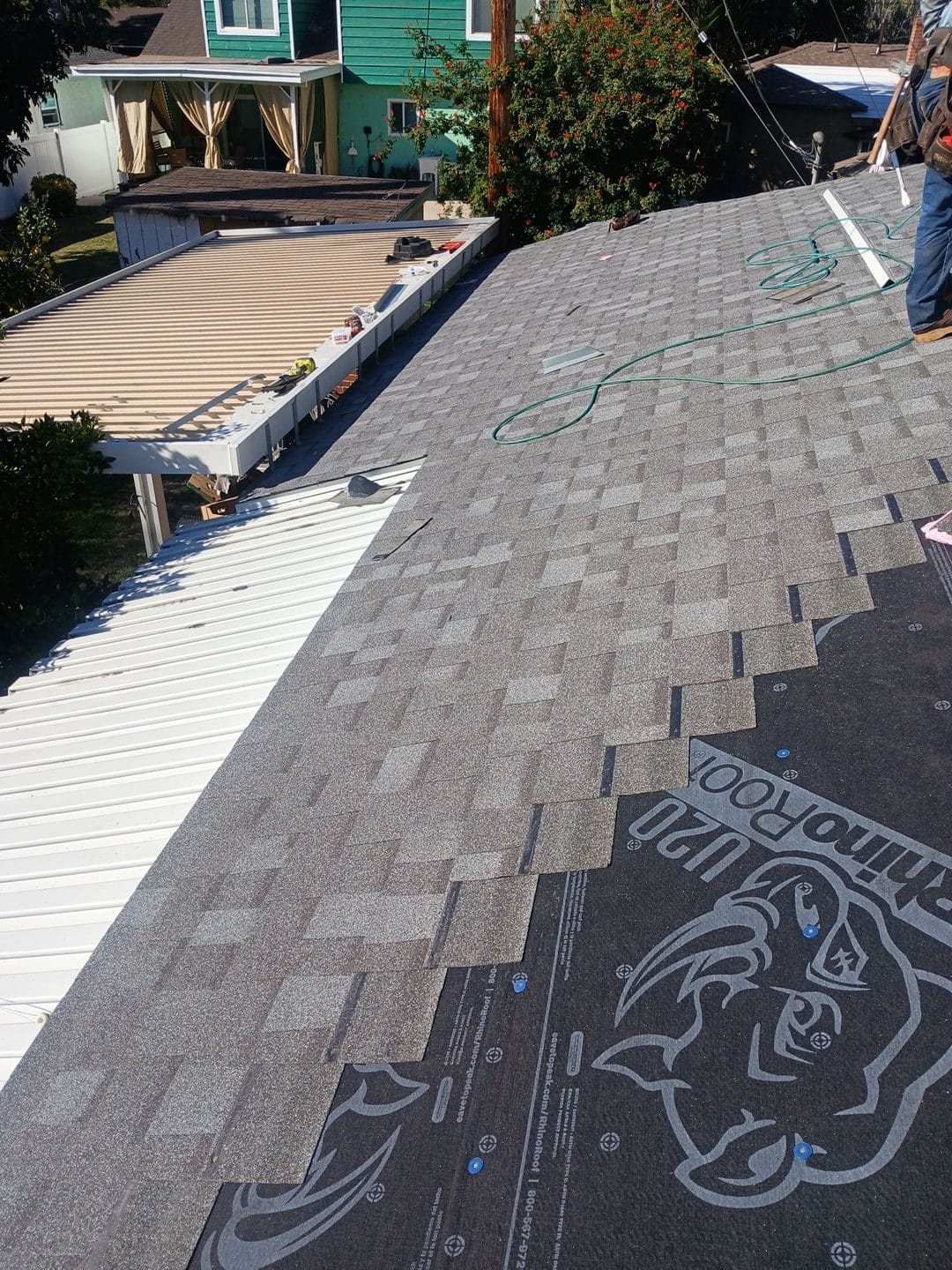 Gray asphalt shingles installed over RhinoRoof underlayment on residential roof | Roof Replacement Inc Gray asphalt shingles installed over RhinoRoof underlayment on residential roof — Roof Replacement Inc