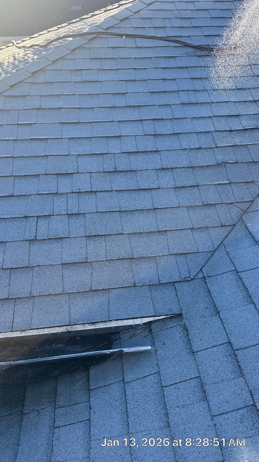 Gray asphalt shingle roof with metal flashing detail at eave | Roof Replacement Inc Gray asphalt shingle roof with metal flashing detail at eave — Roof Replacement Inc