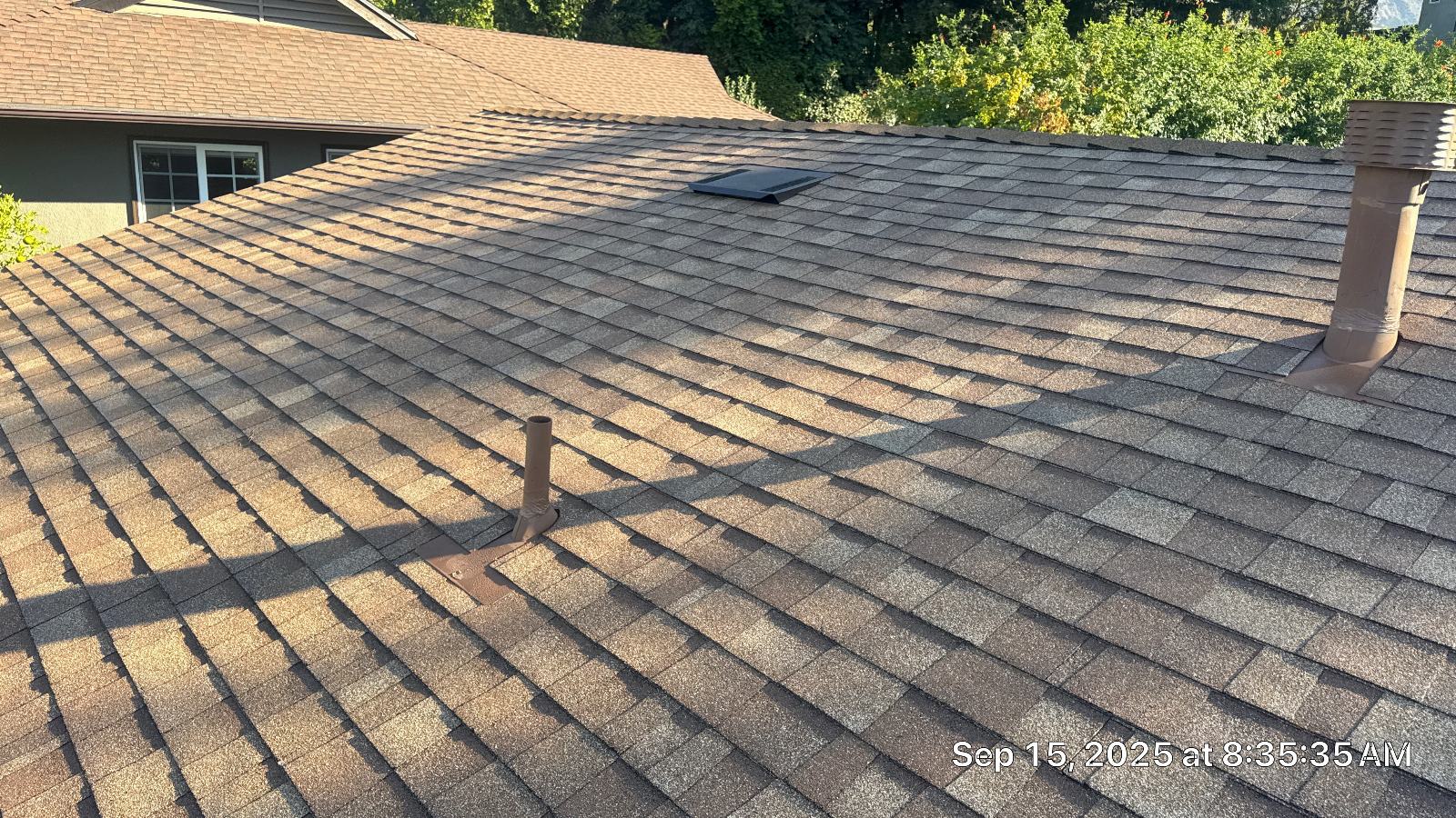 Asphalt shingle roof with pipe boot flashing and skylight in Altadena | Roof Replacement Inc asphalt shingle roof with pipe boot flashing and skylight — Altadena — Roof Replacement Inc