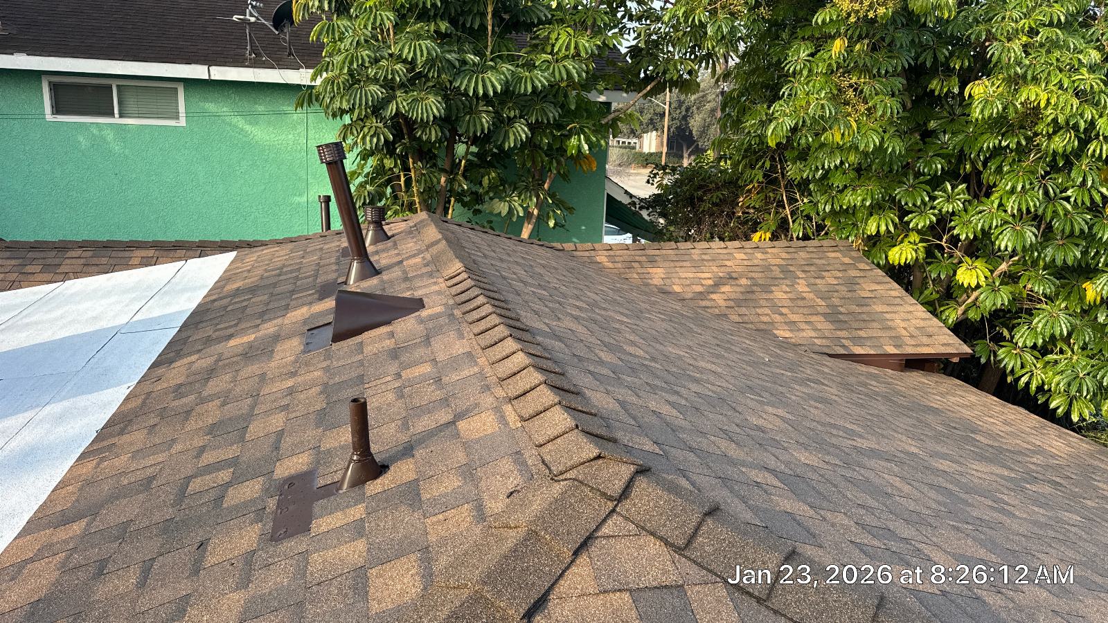 asphalt shingle roof with pipe boots and flat roof section — Burbank — Roof Replacement Inc
