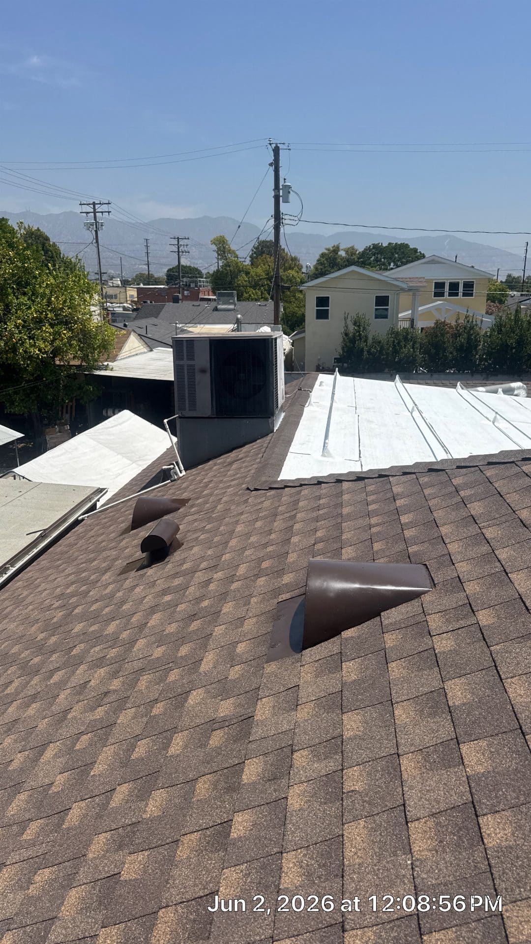 Asphalt shingle roof with pipe boots and flat roof HVAC unit | Roof Replacement Inc asphalt shingle roof with pipe boots and flat roof HVAC unit — Roof Replacement Inc