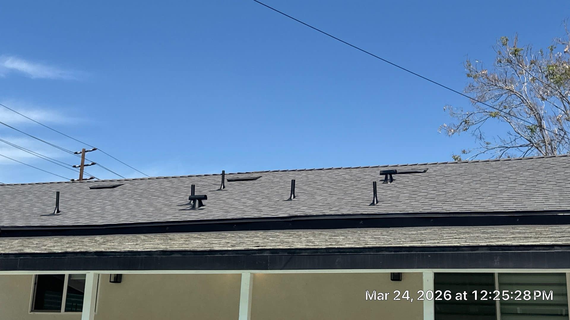 Asphalt shingle roof with pipe boots and plumbing vents installed | Roof Replacement Inc Asphalt shingle roof with pipe boots and plumbing vents installed — Roof Replacement Inc
