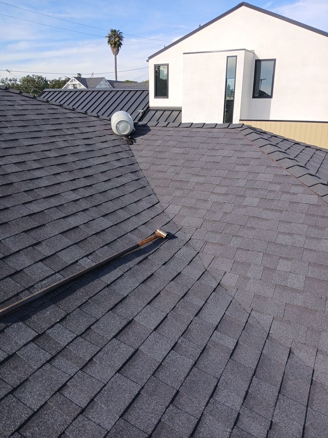 Dark asphalt shingle roof with pipe vent, metal flashing, and dormer | Roof Replacement Inc Dark asphalt shingle roof with pipe vent, metal flashing, and dormer — Roof Replacement Inc