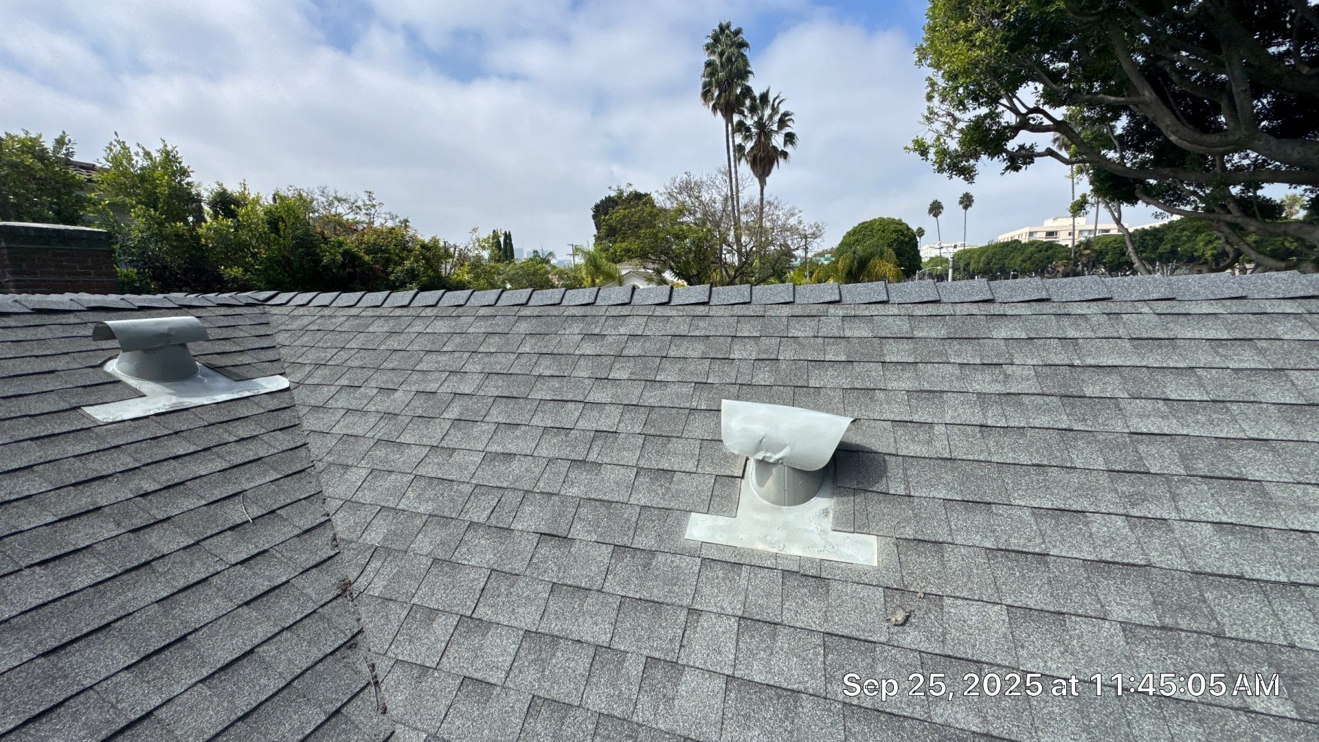 Gray asphalt shingle roof with two metal pipe vents in Beverly Hills | Roof Replacement Inc gray asphalt shingle roof with two metal pipe vents — Beverly Hills — Roof Replacement Inc