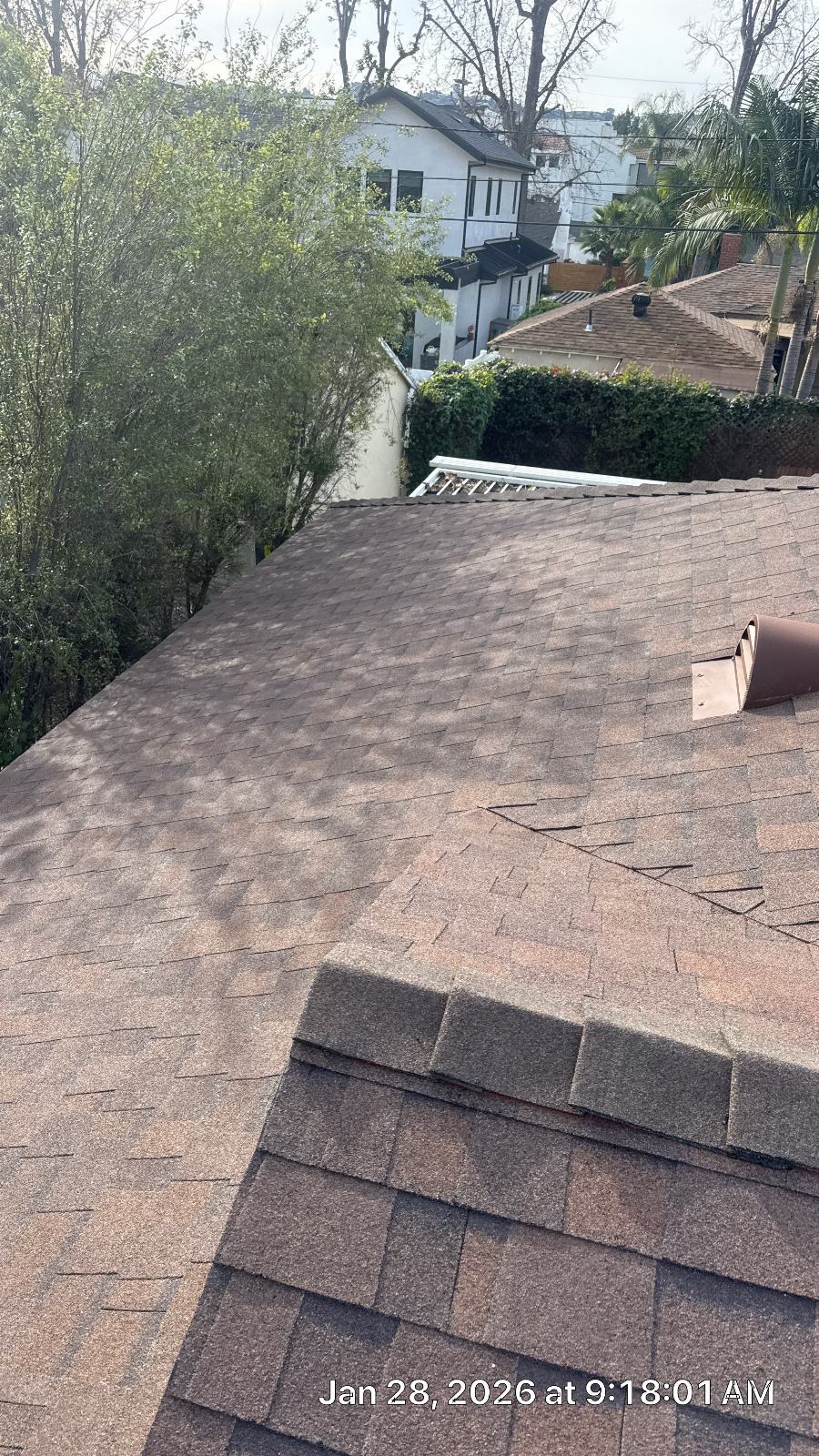 Asphalt shingle roof slope with ridge cap and pipe boot | Roof Replacement Inc Asphalt shingle roof slope with ridge cap and pipe boot — Roof Replacement Inc